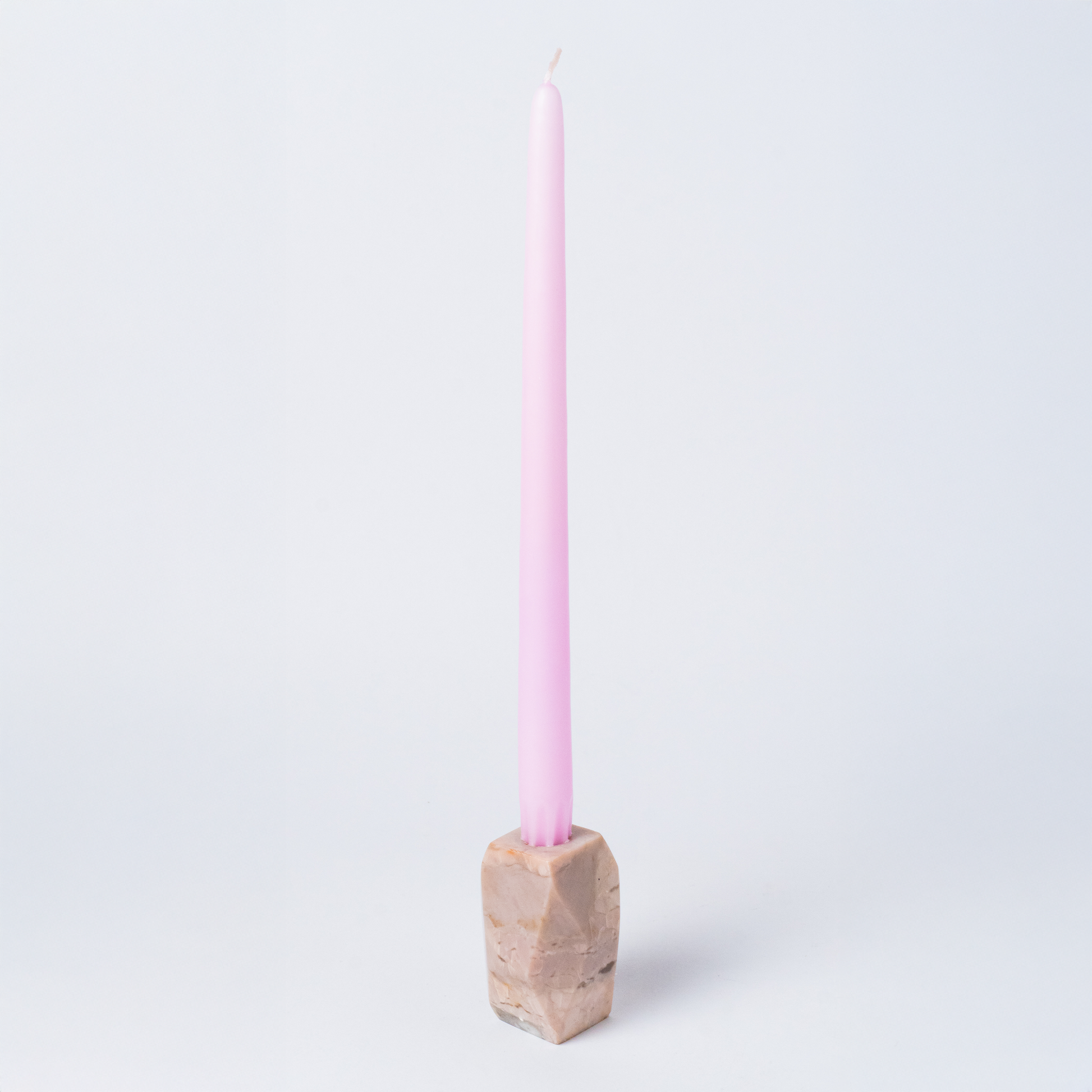 Full view of the solid faceted soapstone gemstone candelabra displaying its natural warm tones on a white background.