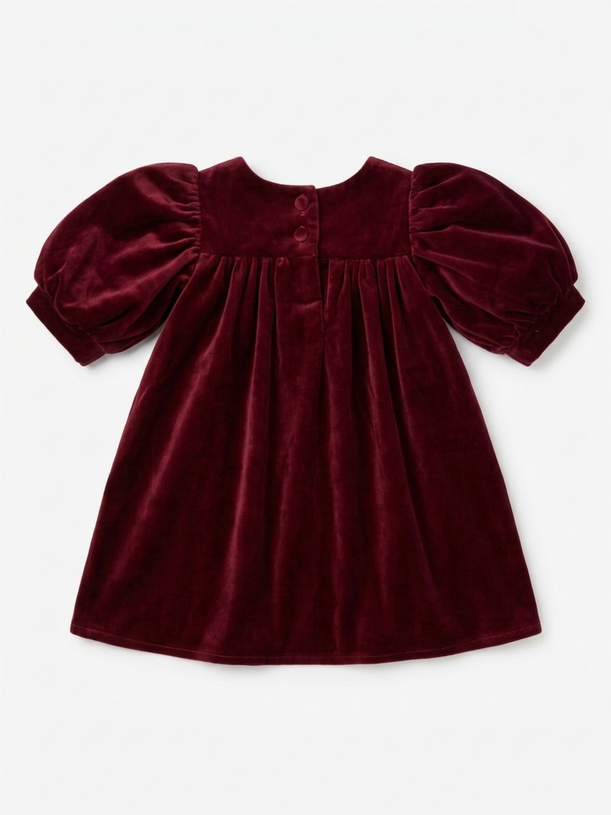 Maroon velvet dress with puff sleeves on a white background