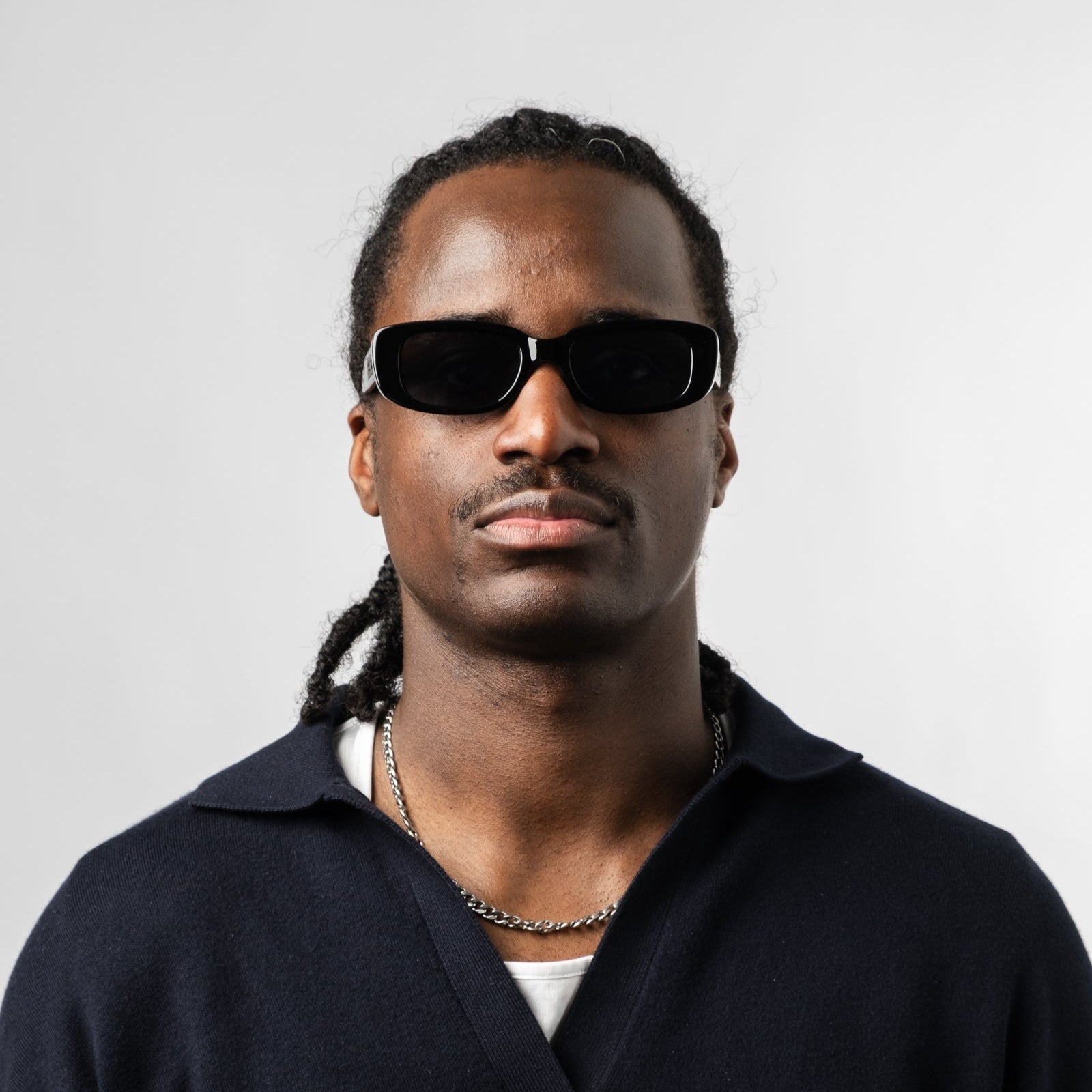 Male wearing Sad Eyewear Bouquet rectangle sunglasses in gloss black with black tinted lenses