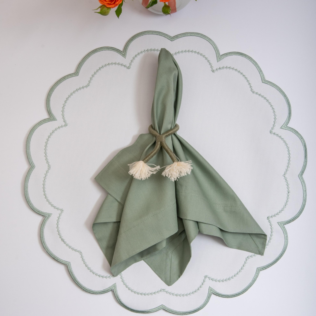 The sage Victoria impermeable placemat with Victorian-style border detail by Talah Home