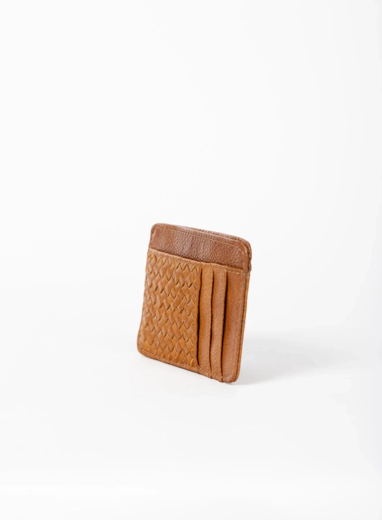 Cognac woven wallet on a white background