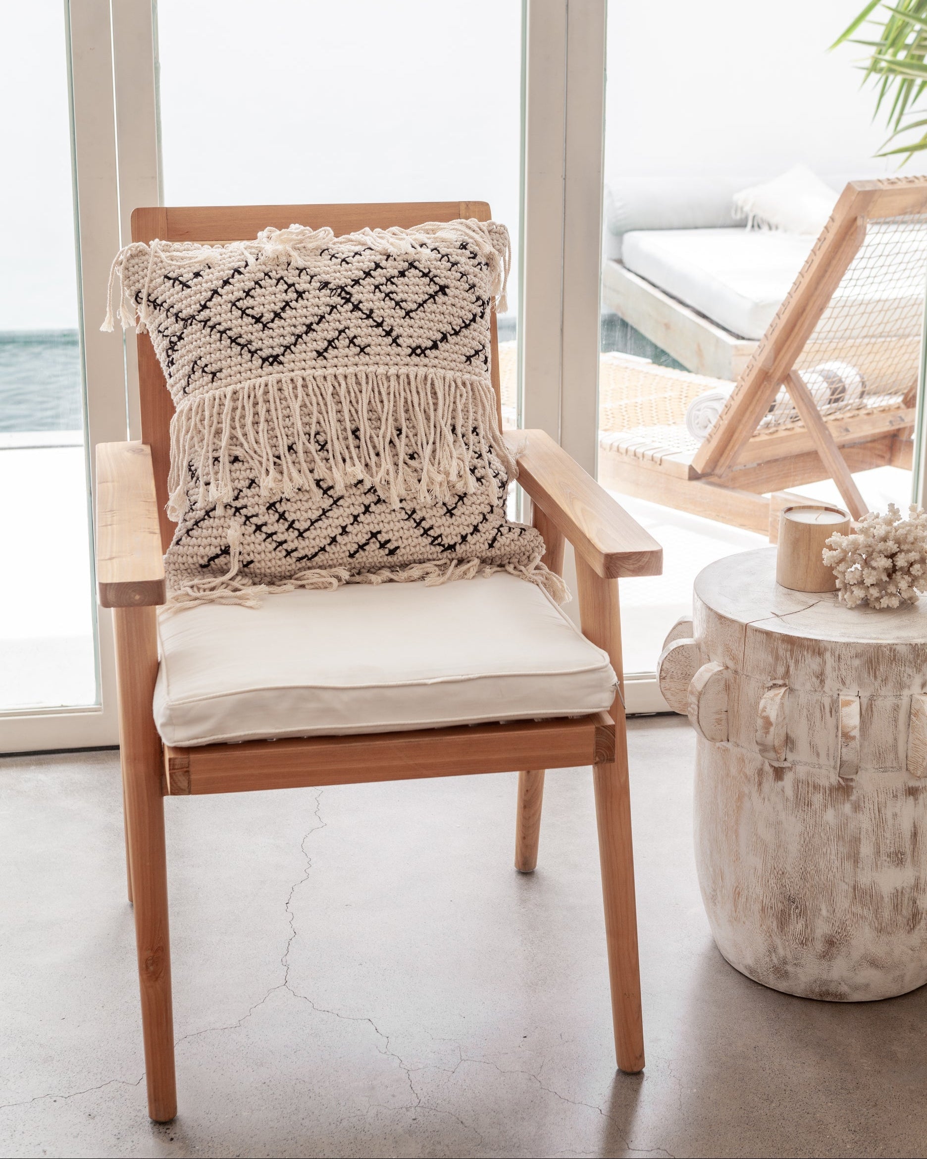 Bohemian Tasseled Macrame Throw Pillow handmade by Village Thrive using natural materials.