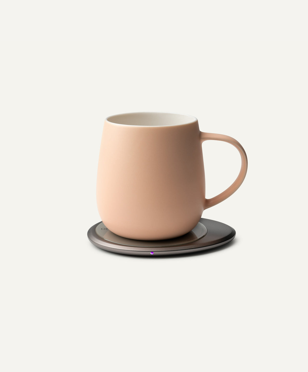 Ui 3 Self-Heating Ceramic Mug 12 fl oz / 355 mL in Rosy Apricot on Ohom Charging Pad 3