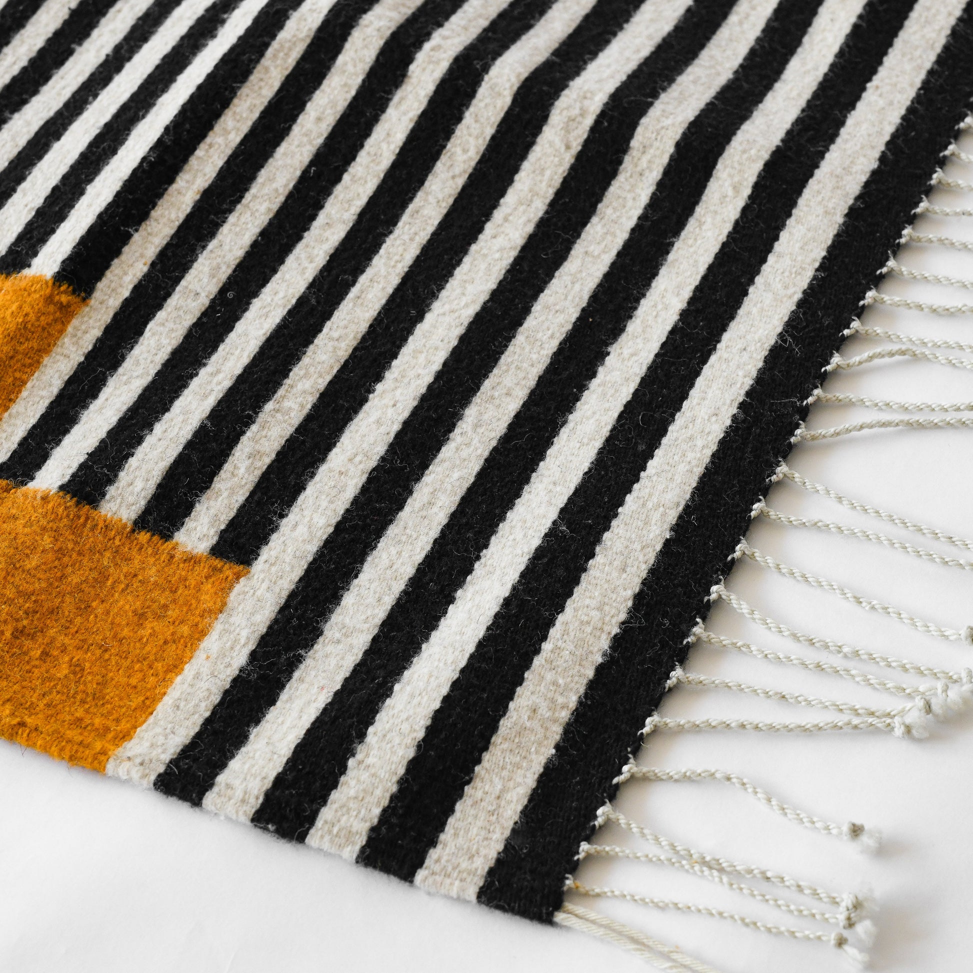 LOOM Imports handwoven ethical flat weave wool rugs. B Corp certified, women owned, fair trade, natural sustainable materials. 