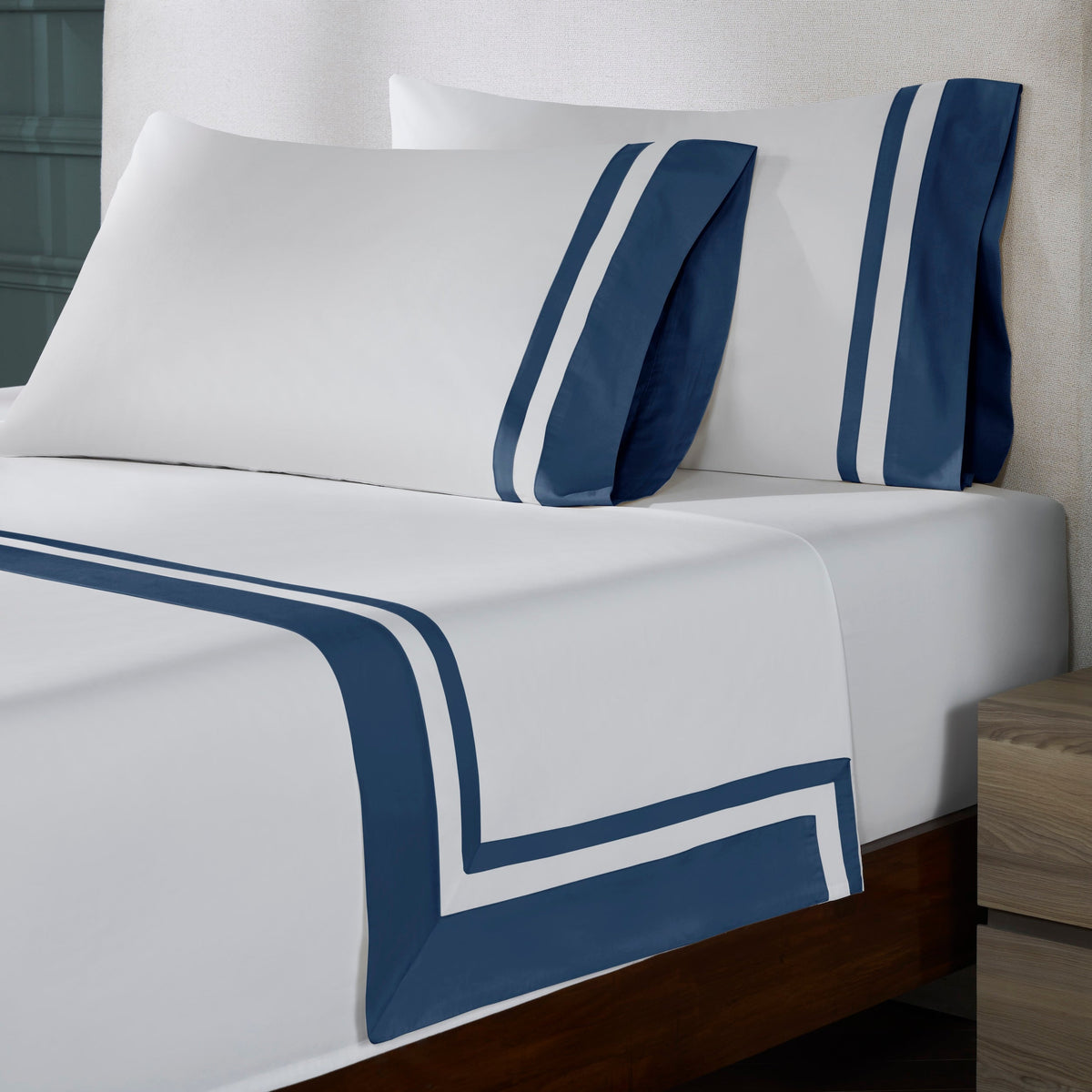 QFL-548-6080_2|Luxurious white 100% cotton sheets and pillowcases. Detailed view of the bold navy blue and white stripe design.