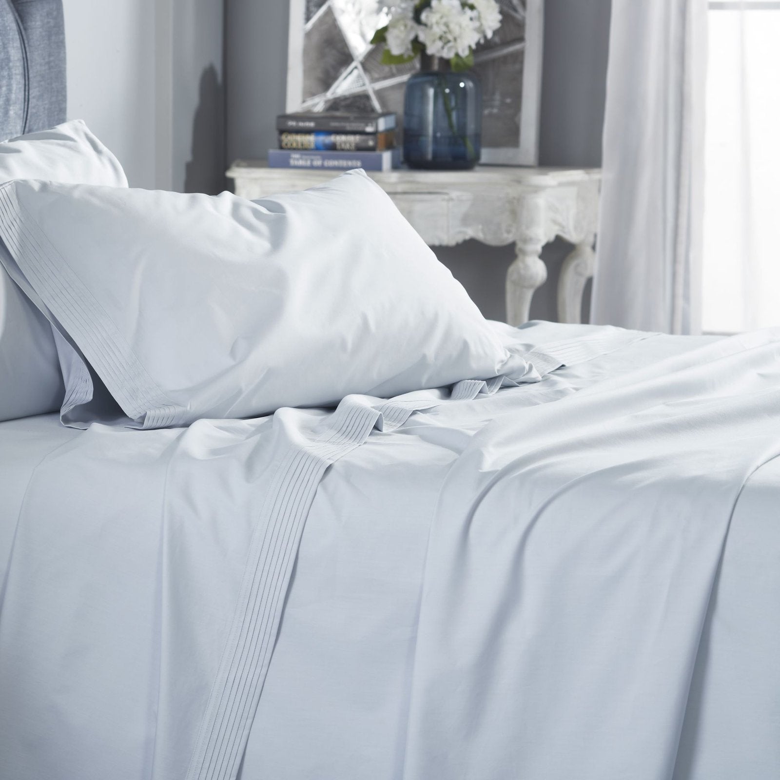CSS-524-7284_4|Serene light blue 100% cotton sheets on a bed, creating a calming and refreshing bedroom atmosphere. Soft, breathable comfort.