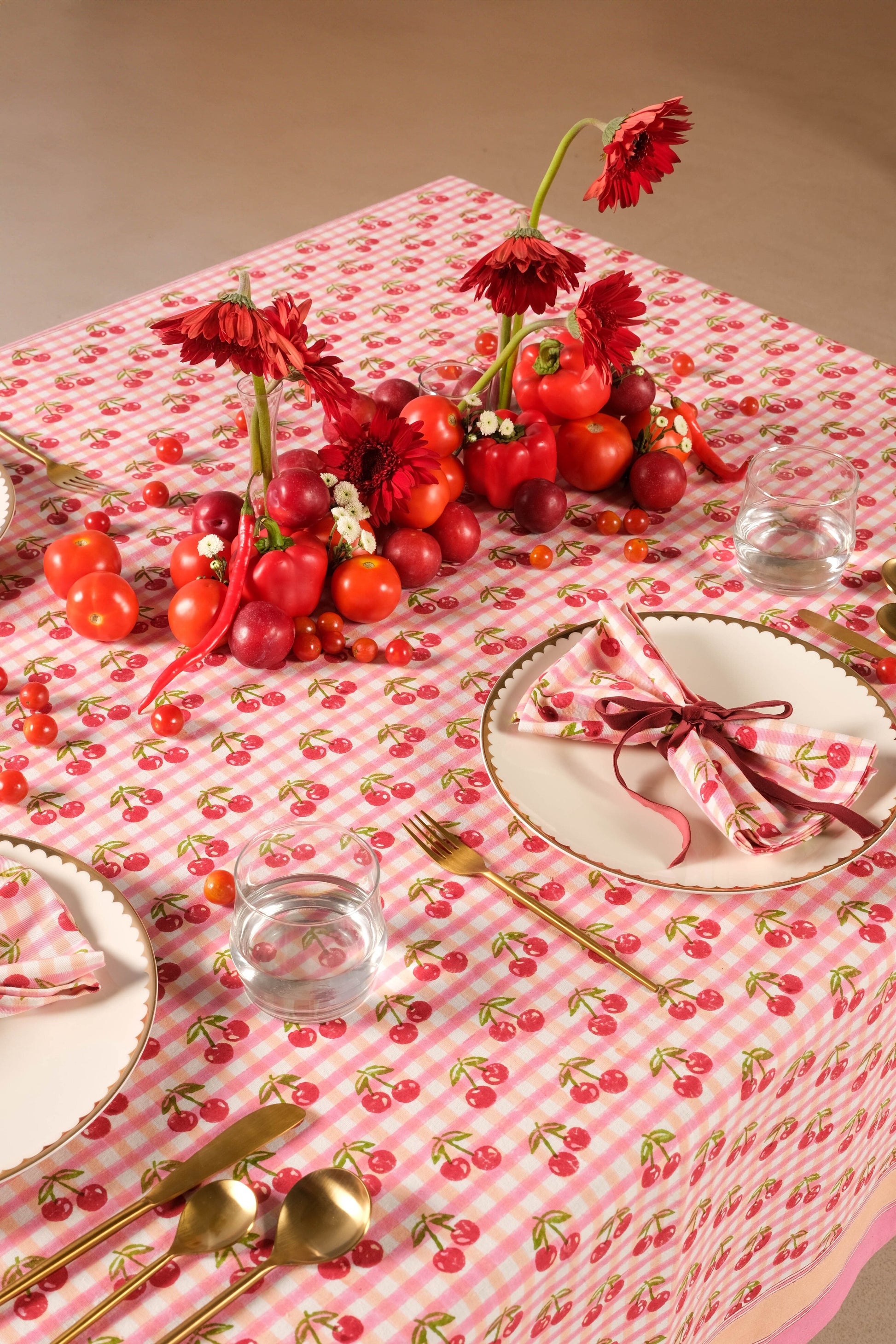 Red gingham cherry blockprint tablecloth with fruit centerpiece