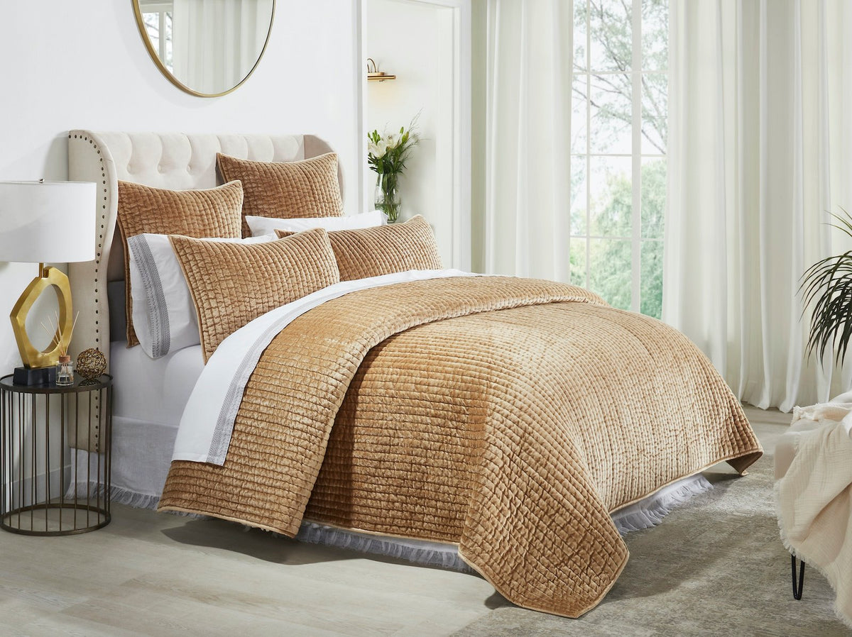 QT-362-9496_1|Luxurious gold velvet quilt featuring a rich textured pattern, elegantly draped on a bed, creating a warm, inviting ambiance.