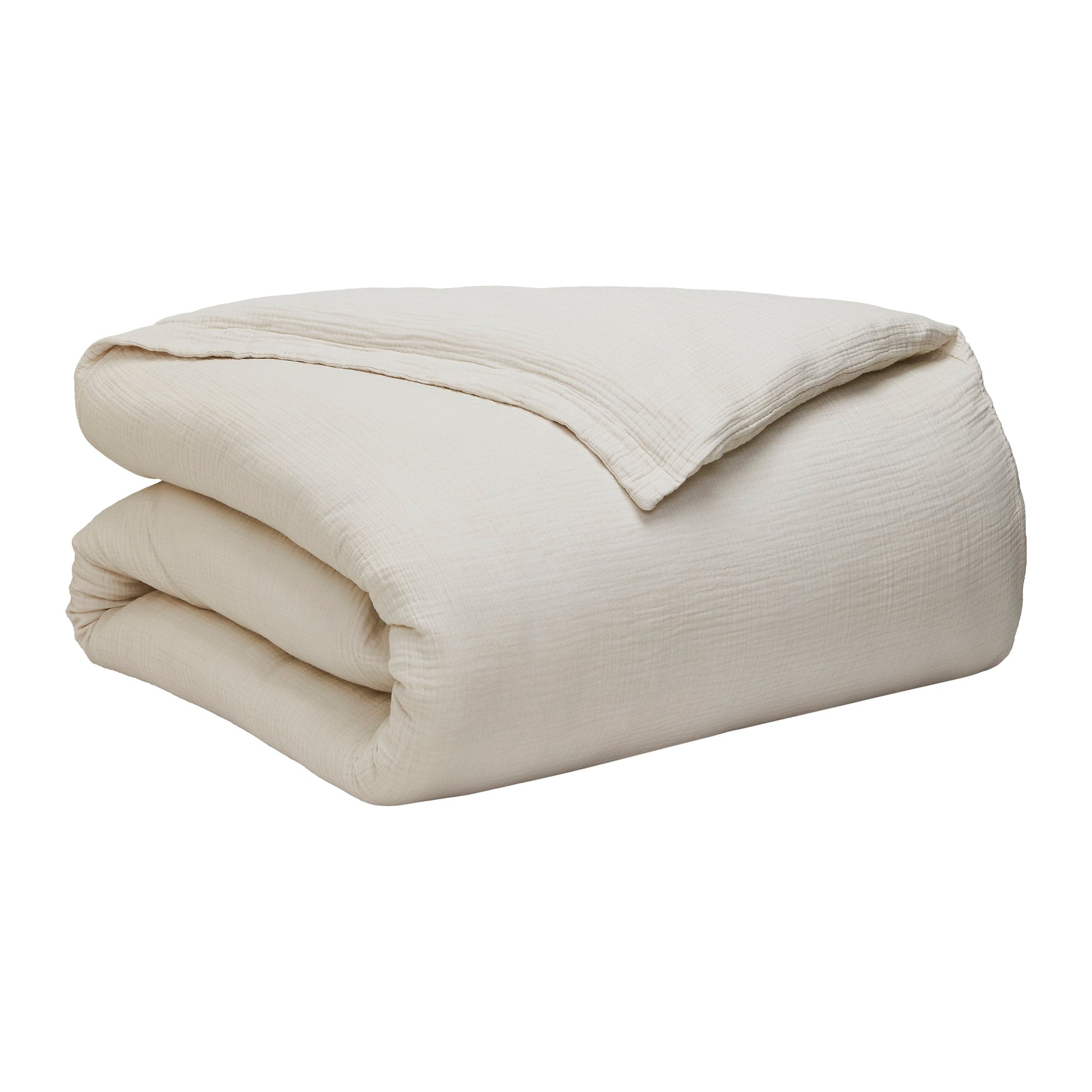 DT-049-9092_10|Neatly folded cream textured duvet cover, highlighting its elegant drape and soft, inviting texture for any bed.