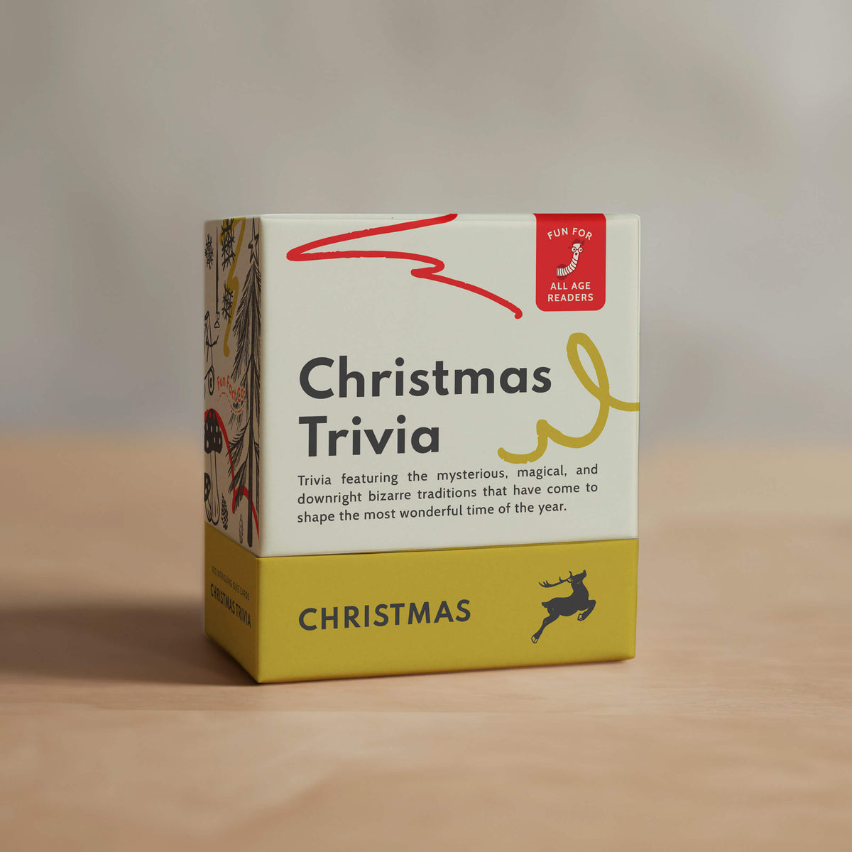 Box of Christmas Trivia game on a wooden surface with a neutral background