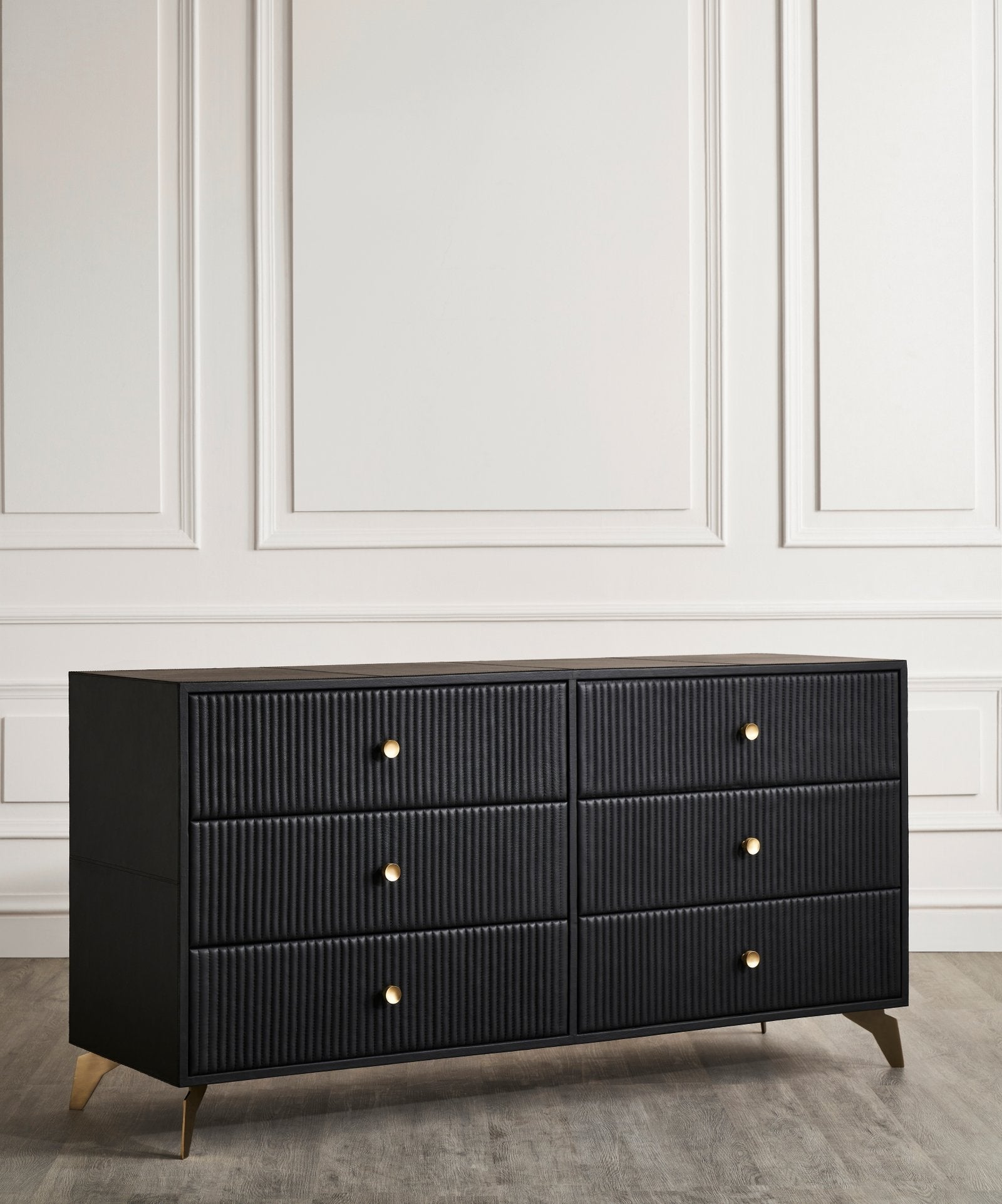 FN-5202-642033_4|Stylish black leather-clad dresser with unique channel-tufted drawers and chic gold hardware, perfect for luxurious bedrooms.