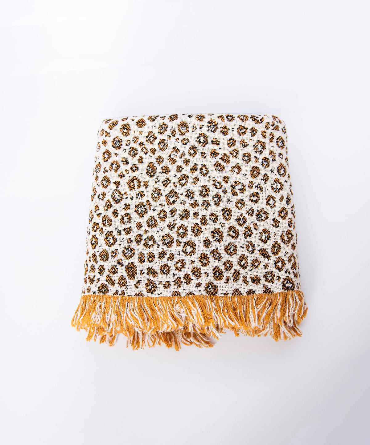 Front view of folded cream and golden leopard-print woven cotton throw on a white background