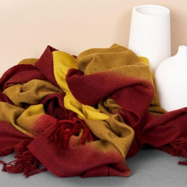 Marigold Merino Ombre Handloom Throw / Blanket Scarf with warm color gradience and hand rolled fringes.