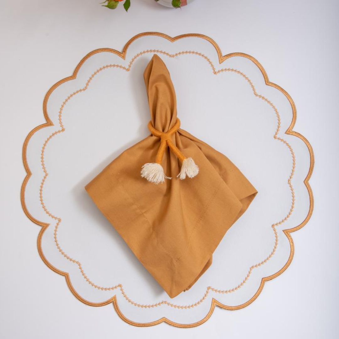 The Victoria impermeable placemat with caramel Victorian-style border detail by Talah Home