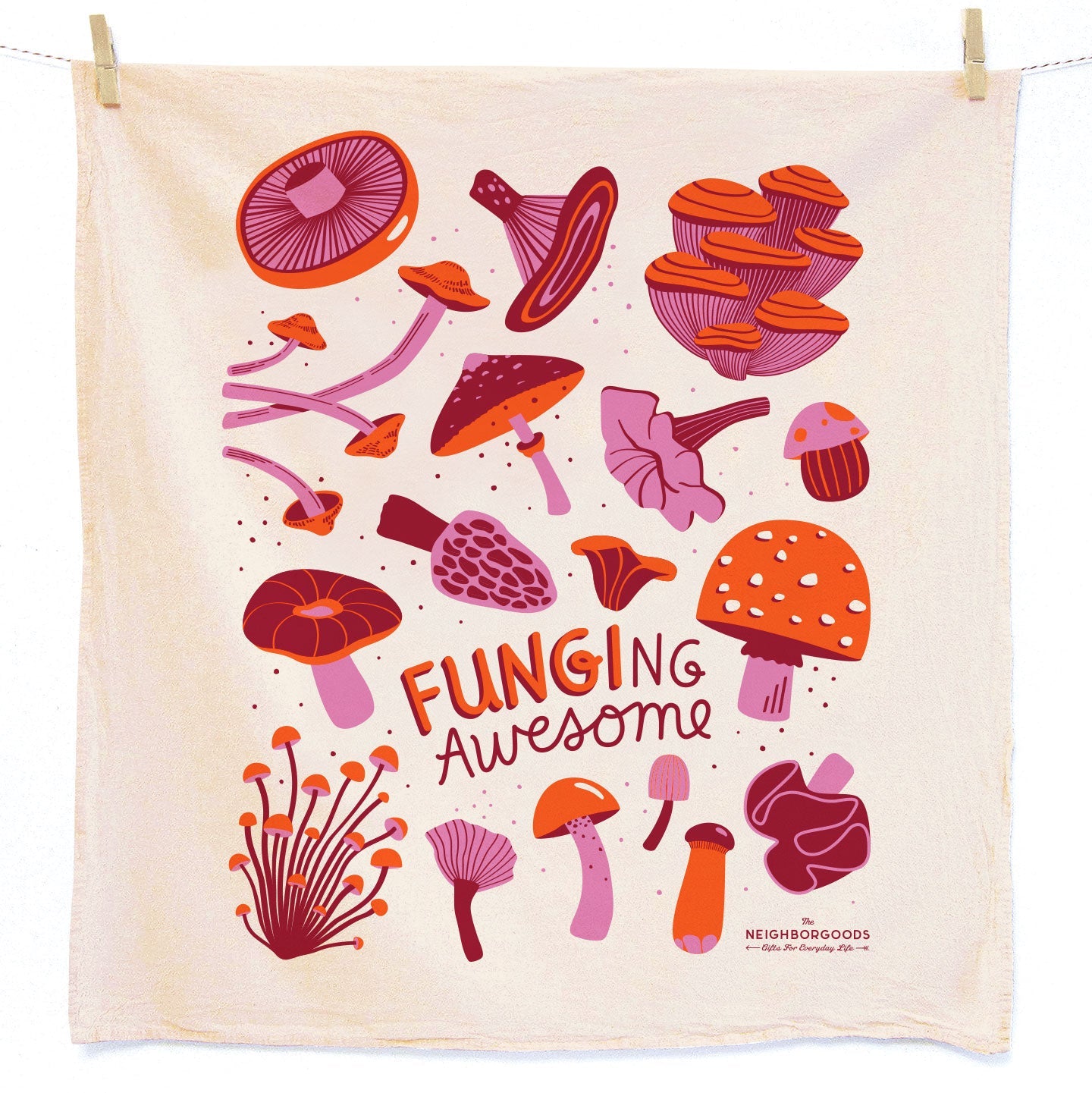 Mushroom towel photographed with mushrooms on a kitchen counter and cutting board