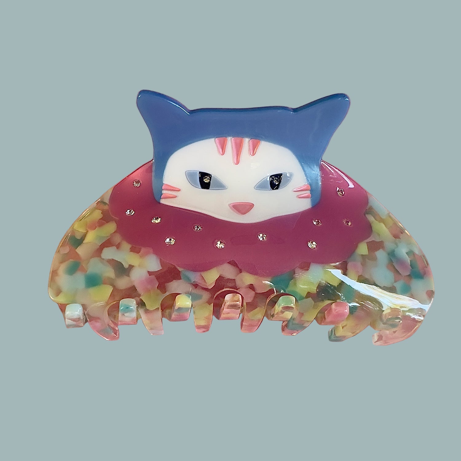 Best Seller Confetti cat clown hair claw with pink  from centinelle. Handmade on cellulose acetate, with splice technique, exquisite miniature details and crystals, that are tied directly to its value and make them unique and special. 