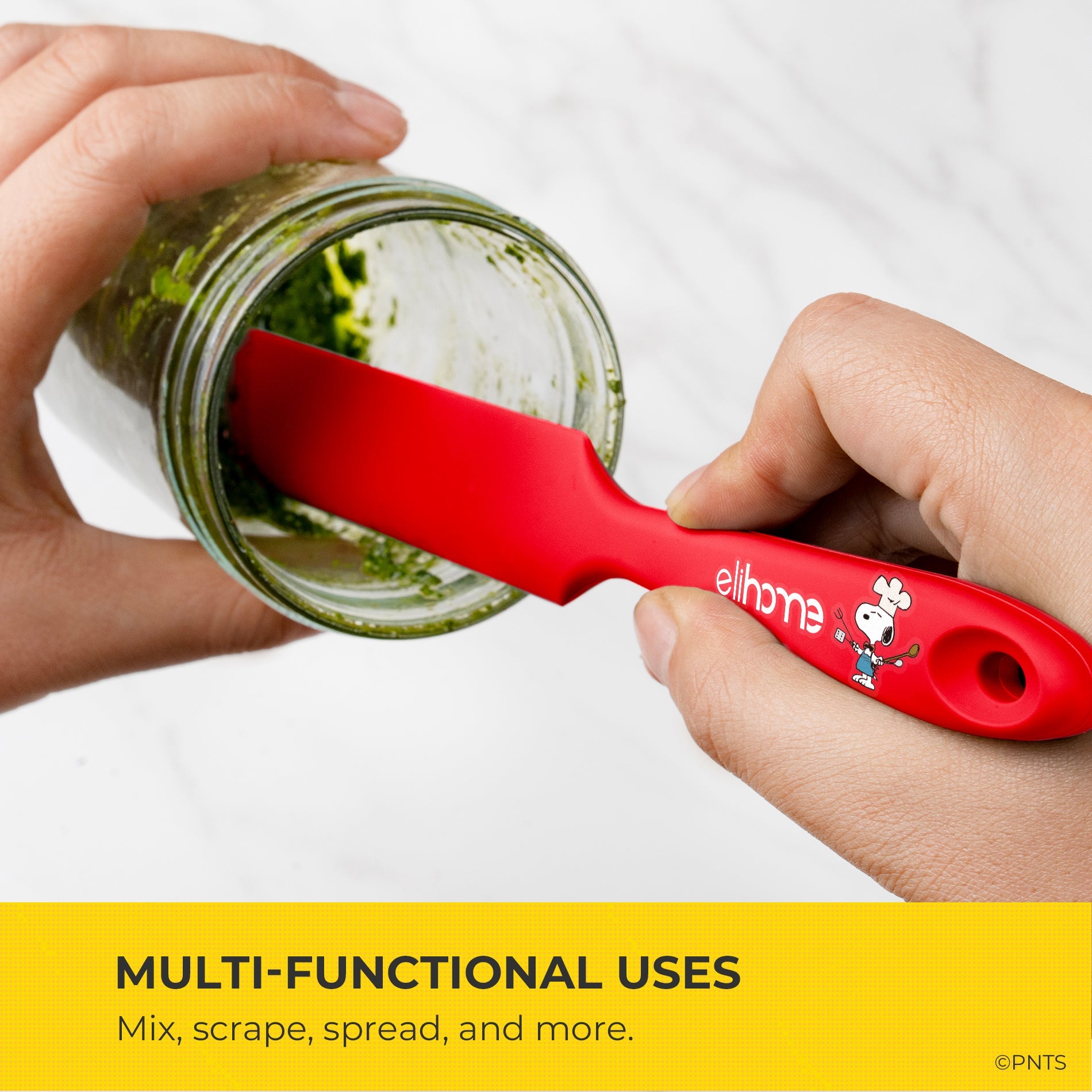 Red spatula with cartoon character being used to mix contents in a jar, with text highlighting multi-functional uses.