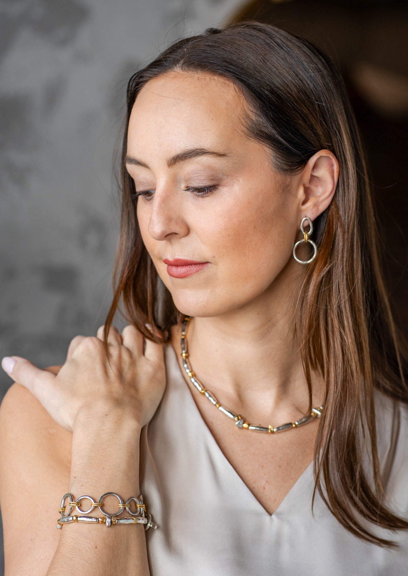 Mixed metal necklace with organic gold and silver-toned beads.