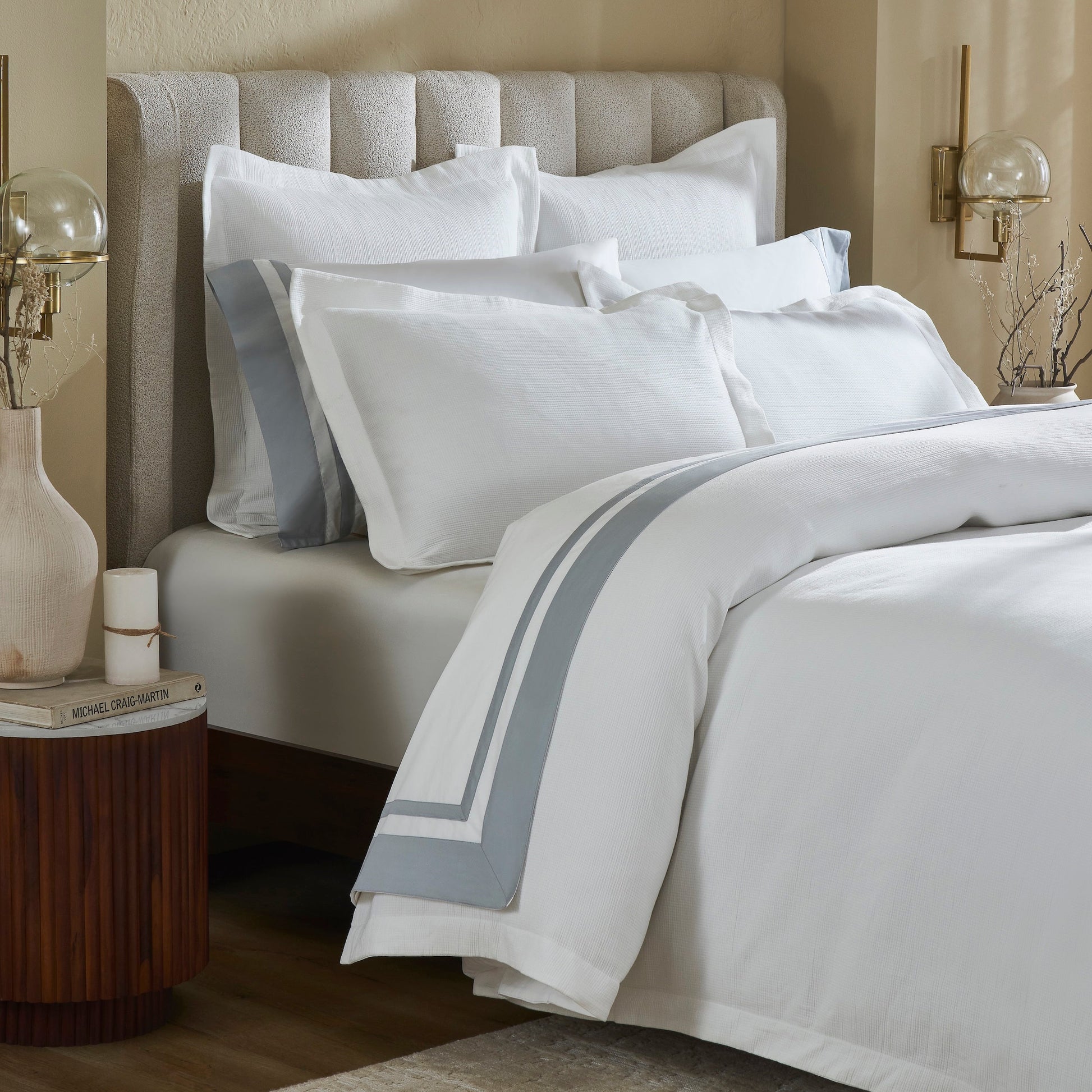 DT-067-10692_4|Sophisticated white textured duvet cover with a stylish grey border, offering refined comfort for a serene bedroom.