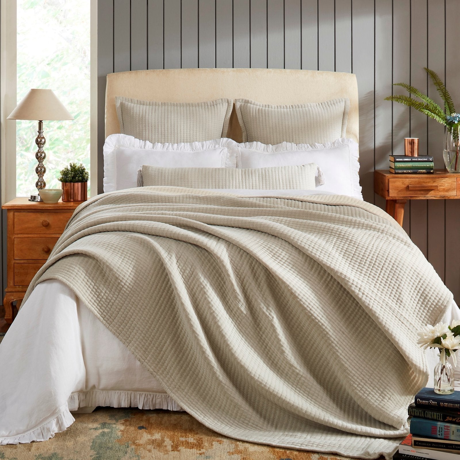 BT-107-11096_1|Cozy beige textured reversible quilt blanket elegantly draped over a bed with white sheets, perfect for inviting bedroom decor.