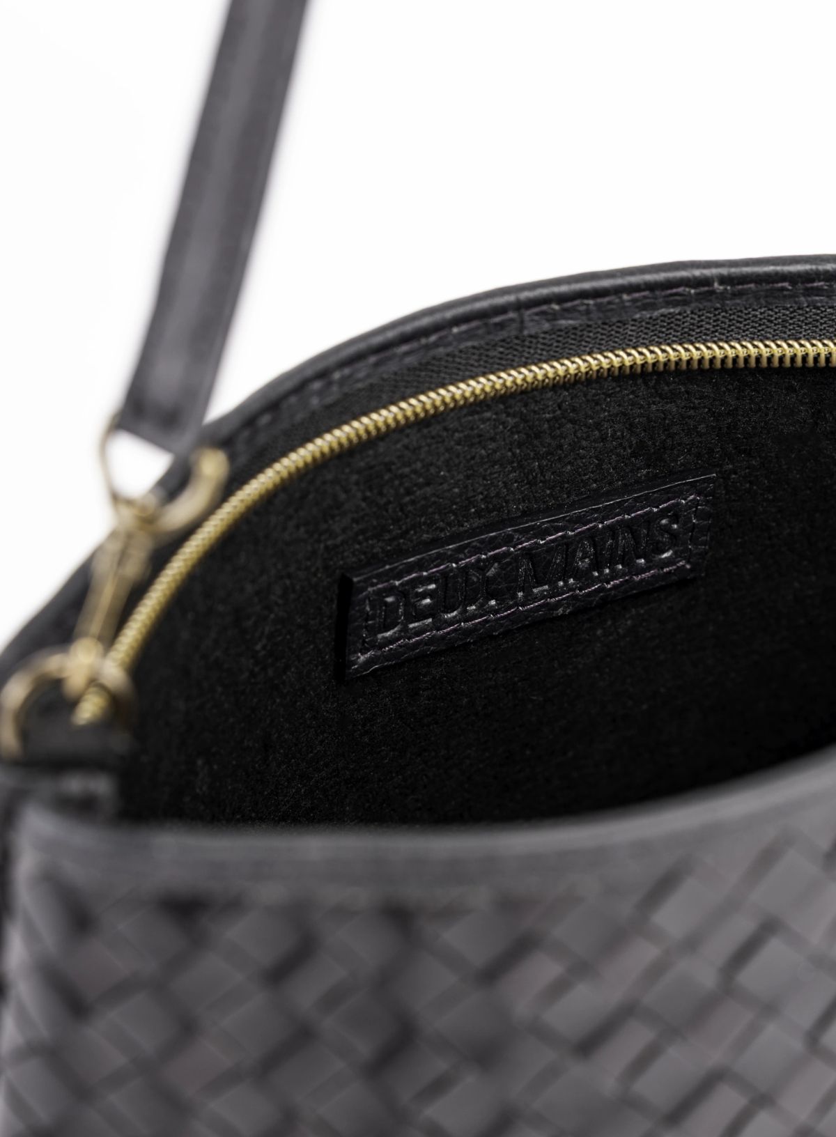 Black woven shoulder bag interior view