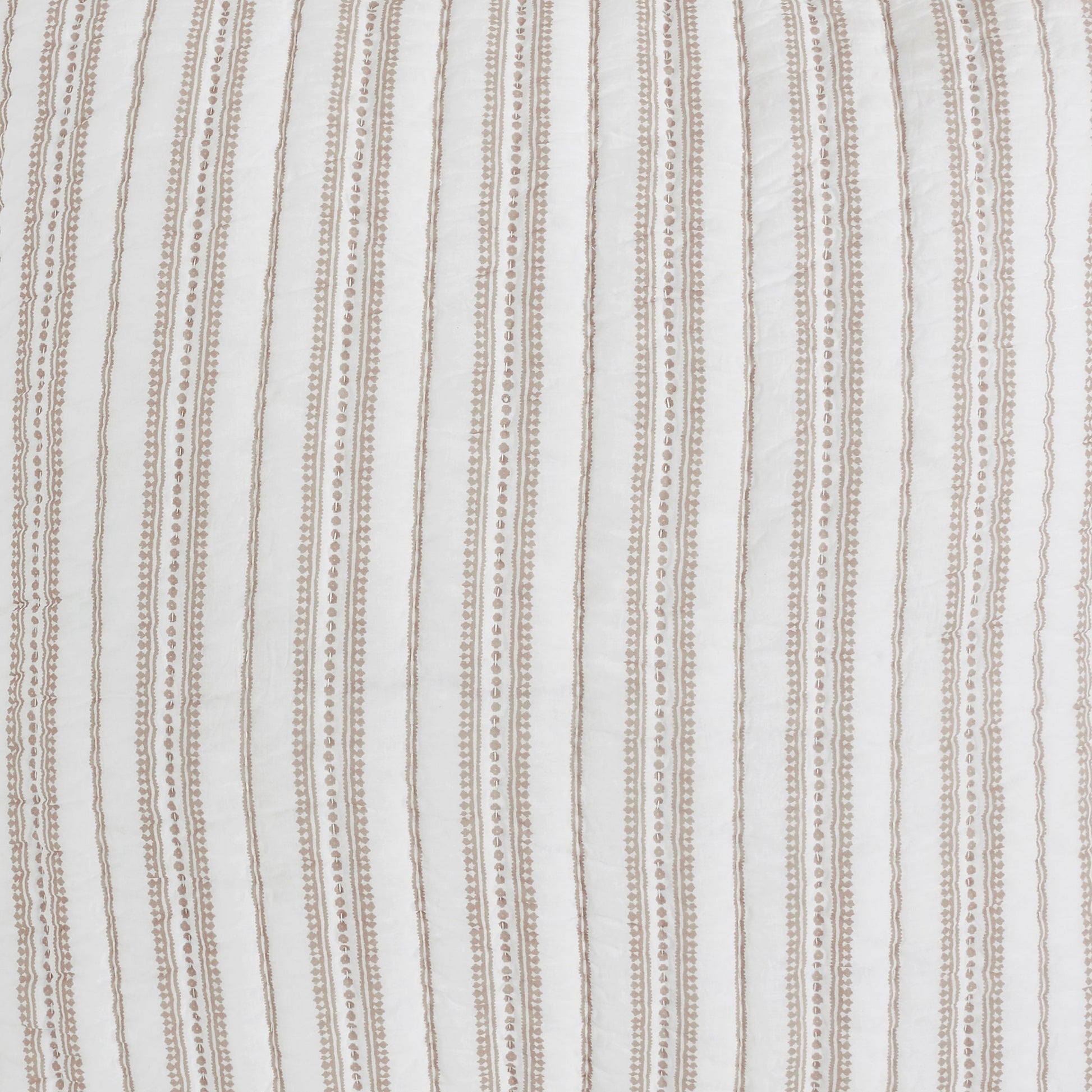 QT-348-9496_9|Close-up of a cream quilt with delicate vertical striped patterns and subtle dotted details. High-quality, textured bedding.