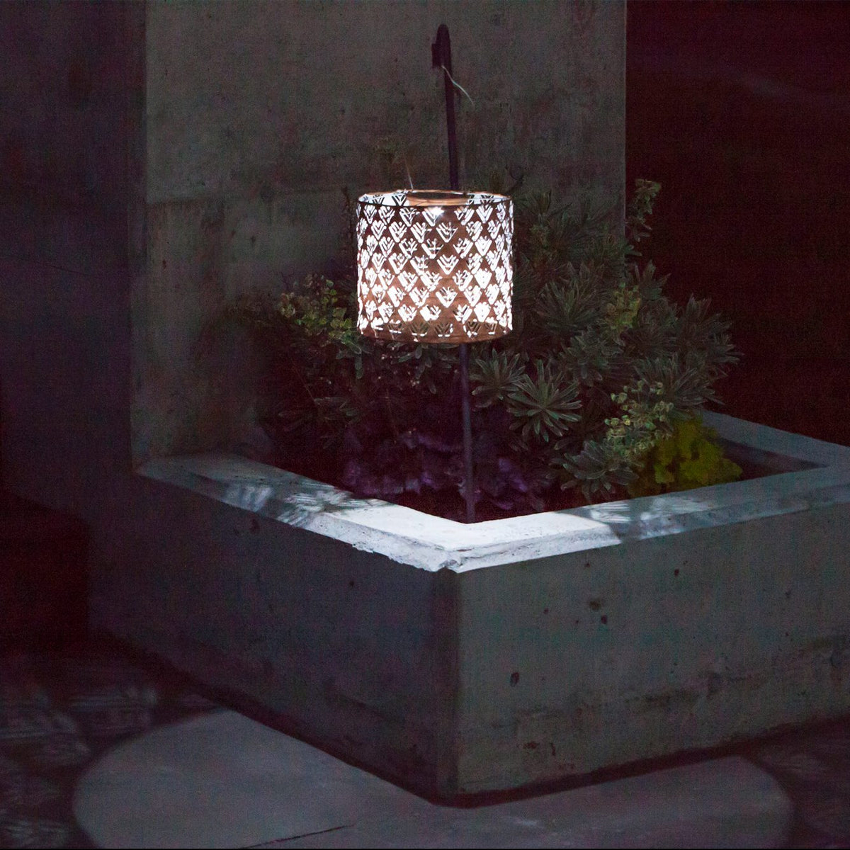 Soji Stella Drum Tyvek Solar Lantern glowing at night