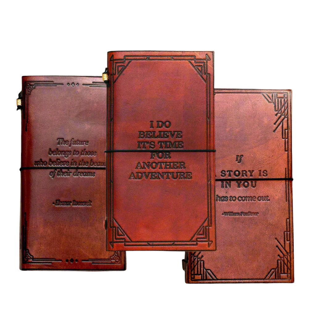 Three brown leather journals with embossed text on a white background