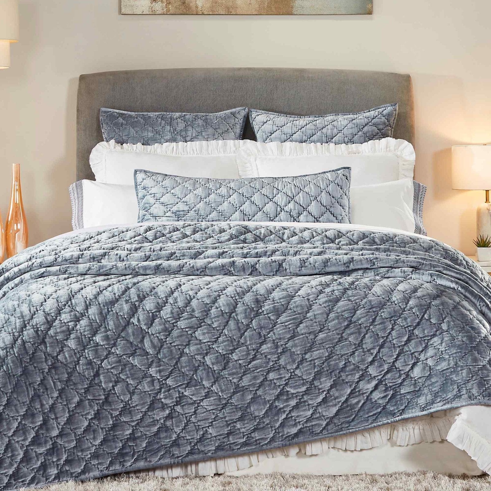QT-341-9496_1|Luxurious blue velvet diamond-quilted quilt on a large bed. Plush texture adds warmth, elegance, and comfort.