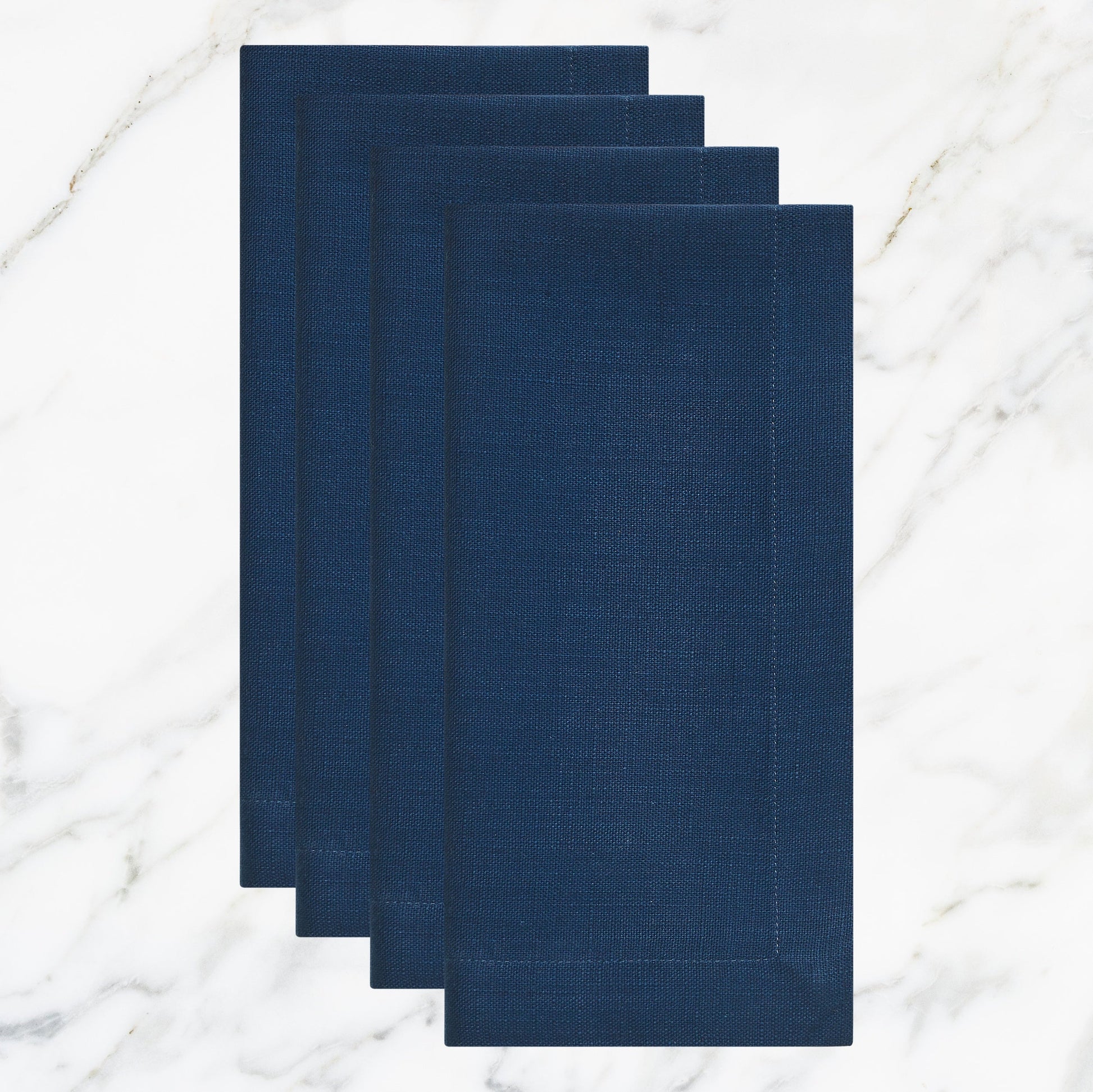 NP-4801-2020_1|Set of four folded navy blue linen-feel cloth dinner napkins, durable and elegant for dining, parties, or everyday use.