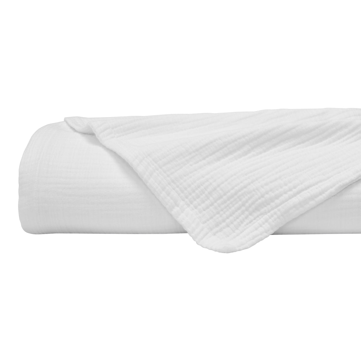 BL-861-11096_6|Rolled white crinkle cotton blanket with a neatly folded corner, showcasing its soft, natural texture and versatile comfort.