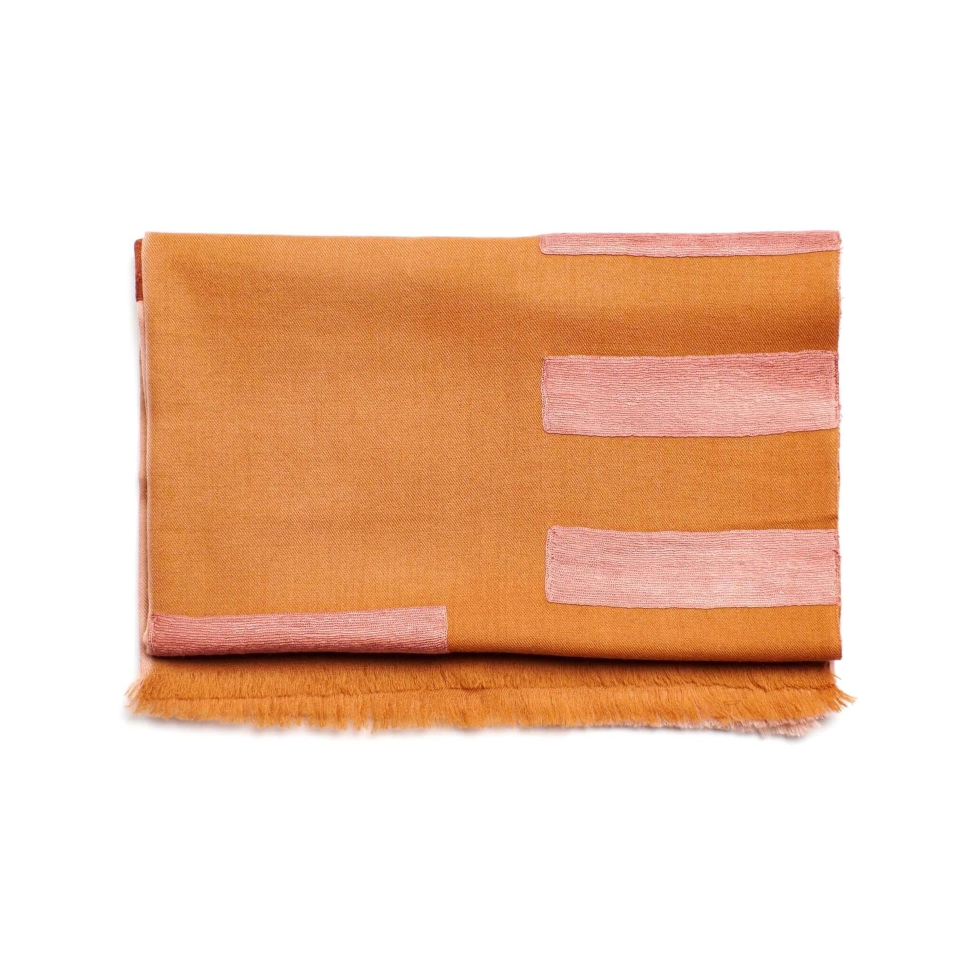 Canyon Hand Embroidered Hand Woven Merino Silk Soft Scarf in warm orange with pink accents.