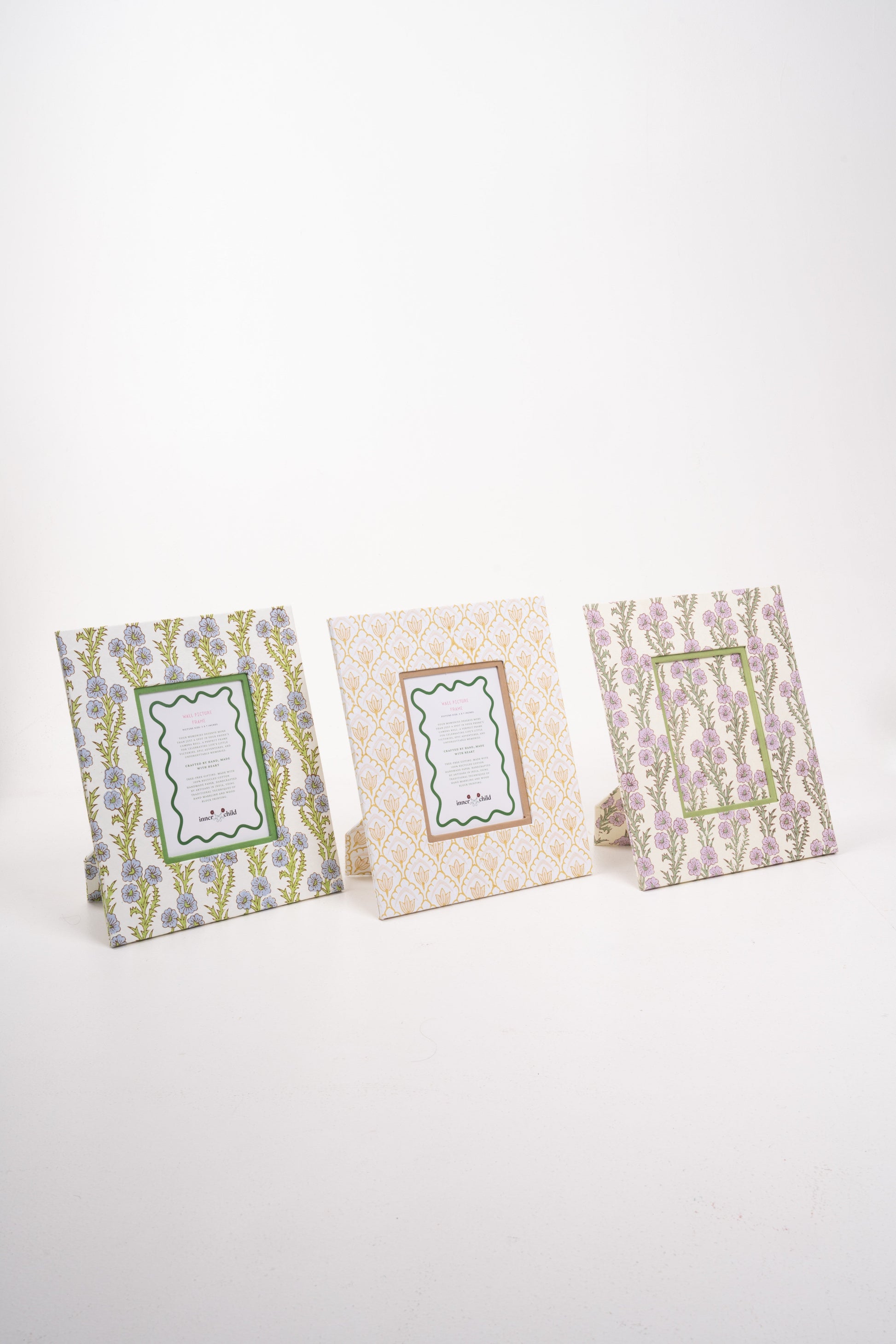 Three forget me not purple 5x7 wall frames with floral designs