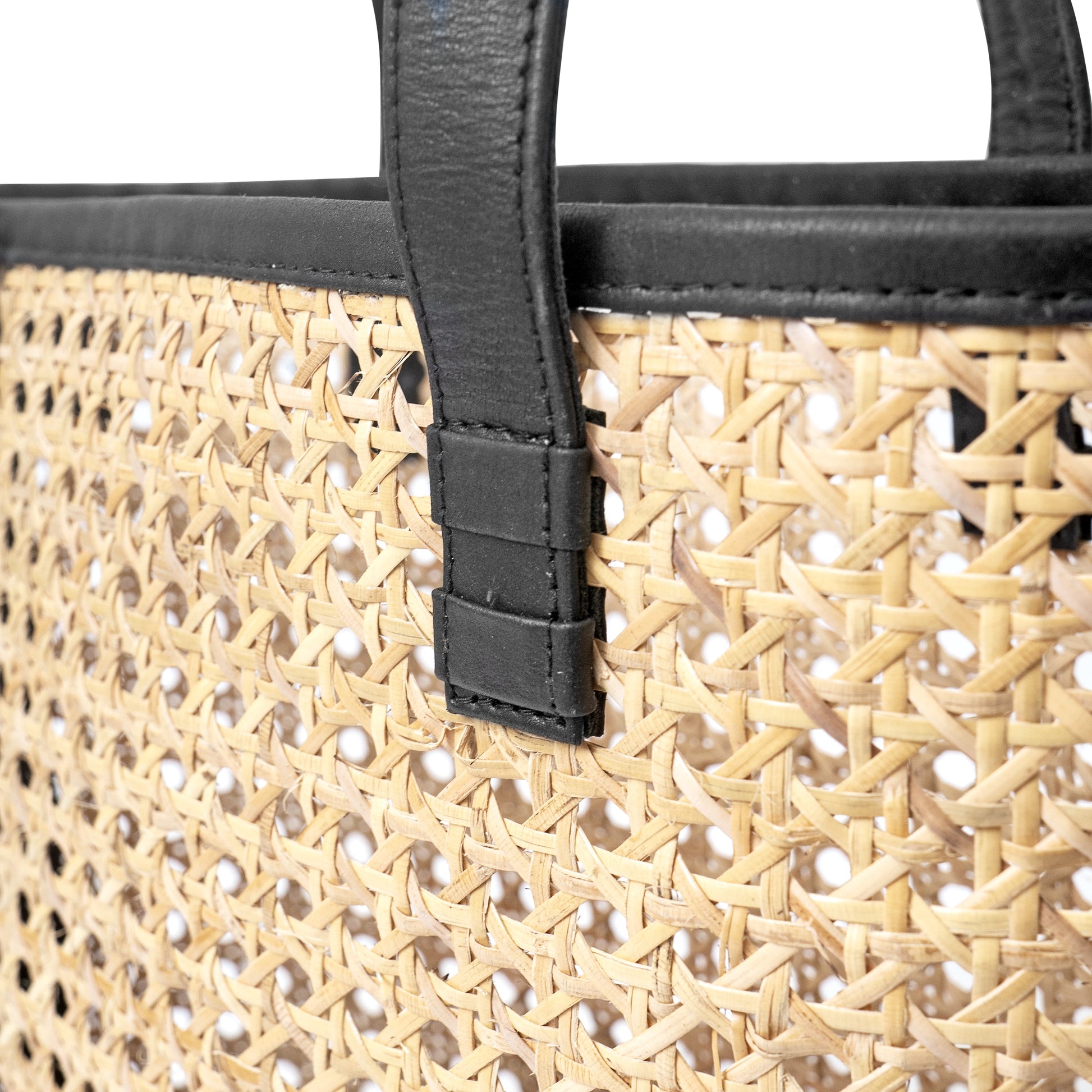 detail view genuine black leather trim and open weave cane basket shoulder tote handbag
