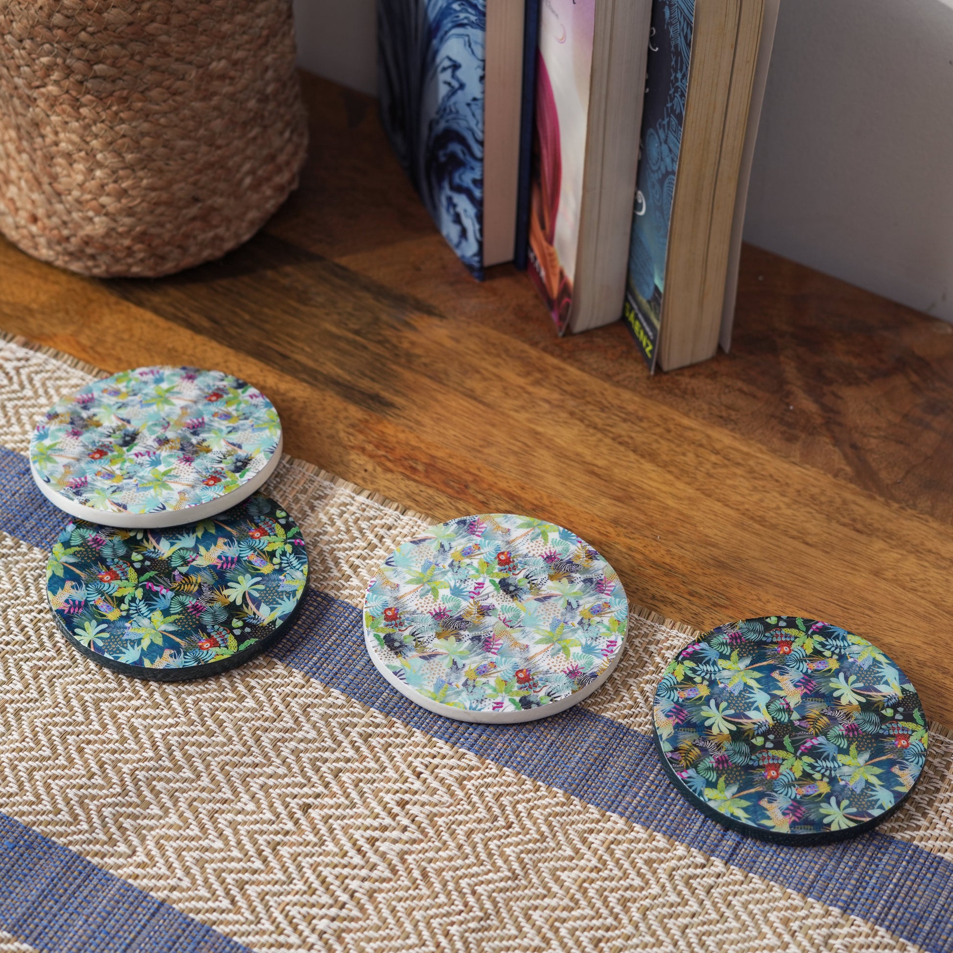 Close-up of the smooth, handcrafted finish on a Jungle Bloom coaster showing intricate multicolored floral motifs.