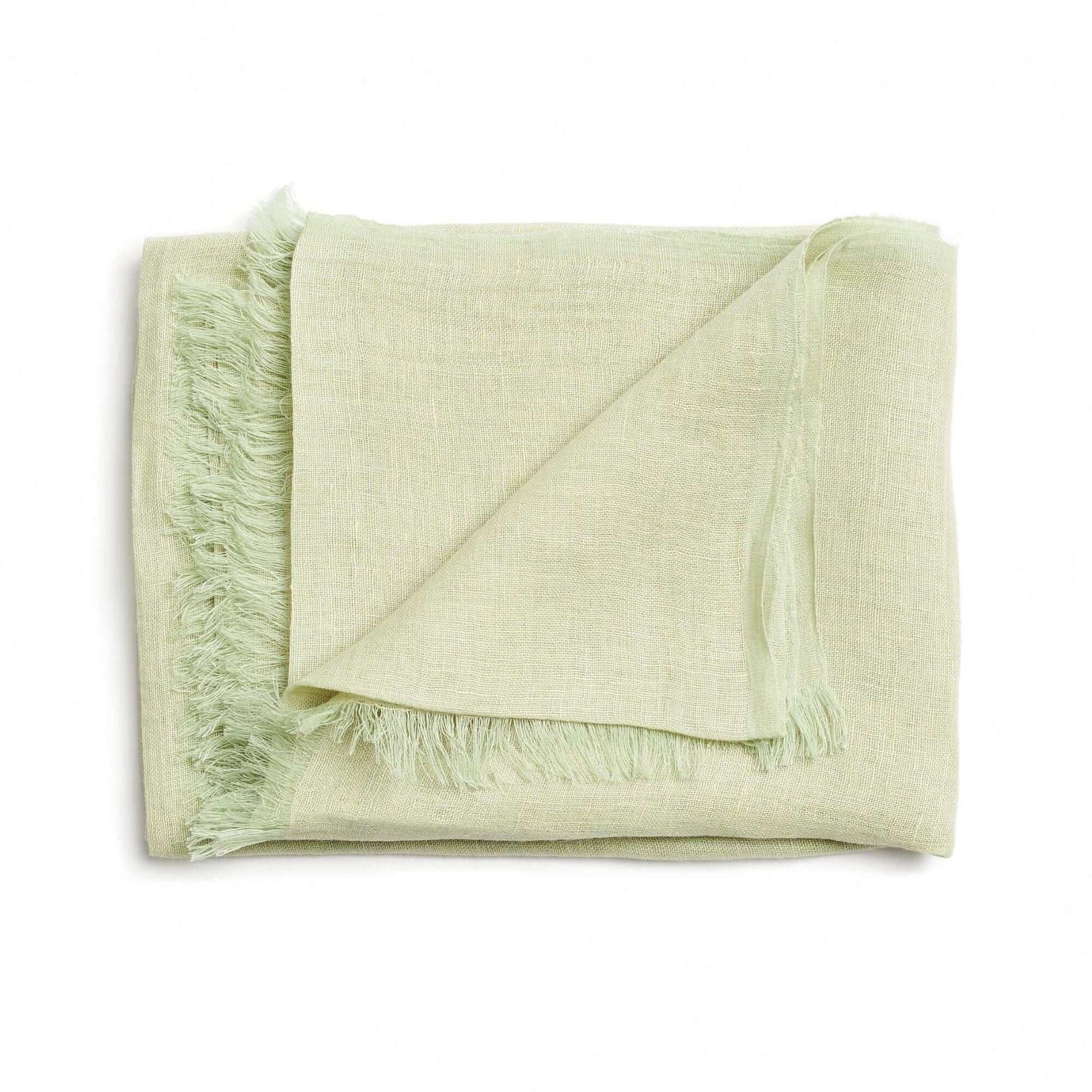 Soya Pastel Lime Green Hand Woven Soft Linen Scarf folded, showcasing its raw texture and earthy tones.