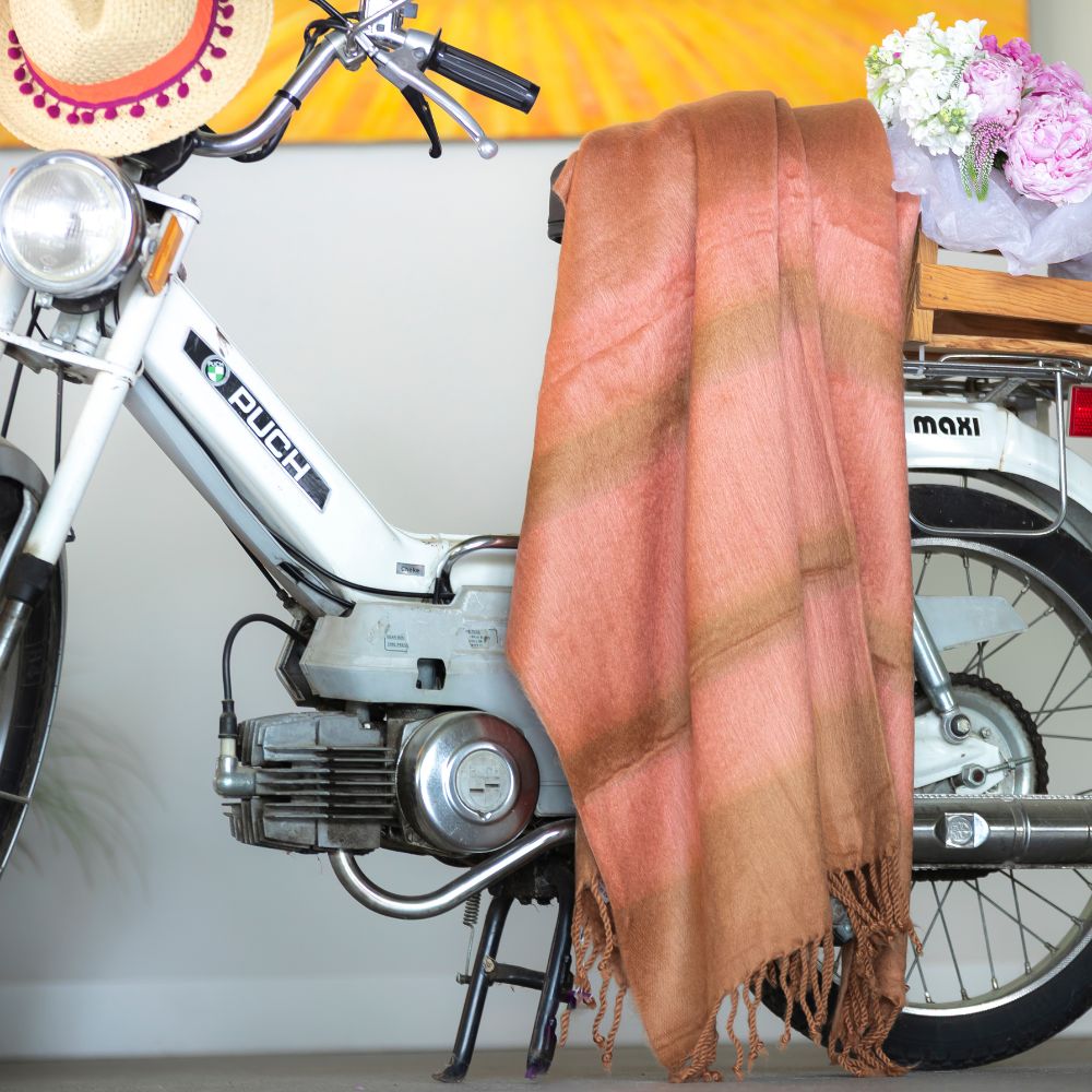 Pink gradient artisanal woven throw display