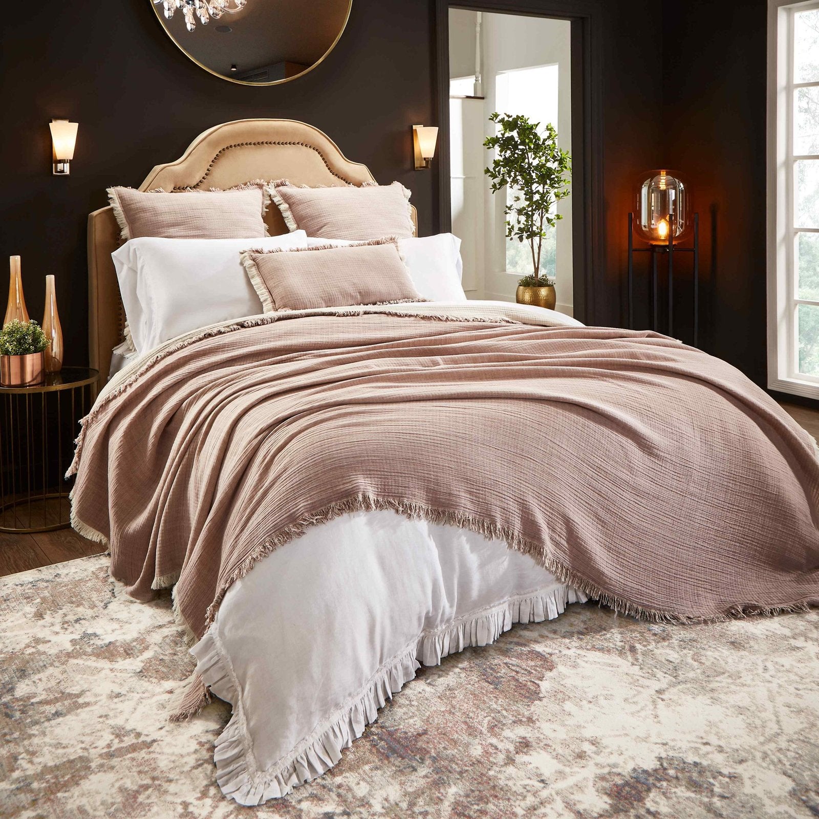 BT-110-9496_1|Blush pink textured cotton blanket with delicate fringe draped over a king bed, enhancing cozy bedroom decor.