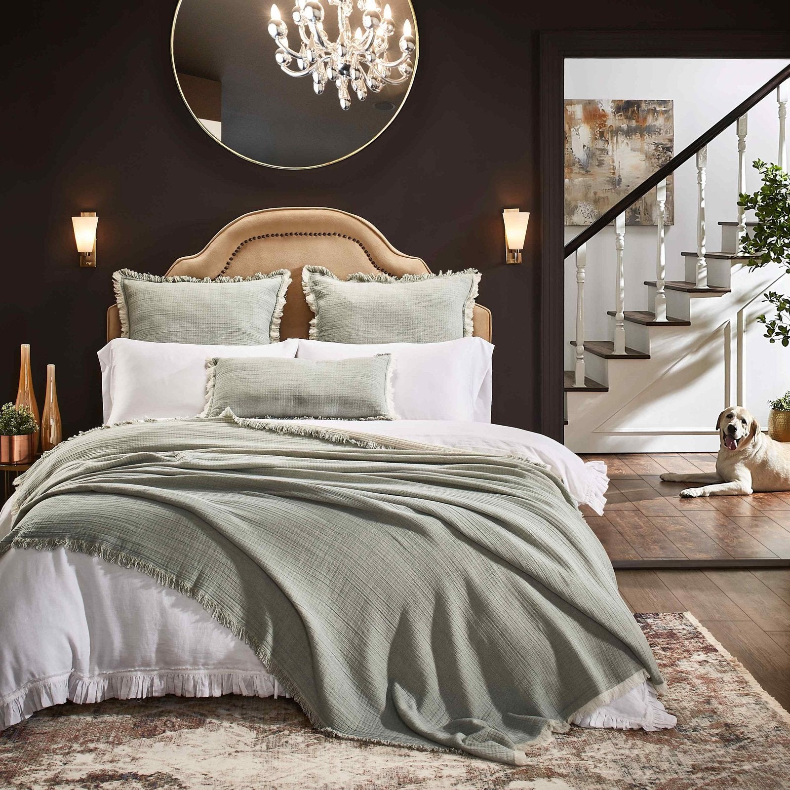 BT-109-9496_5|Stylish sage green crinkled blanket with frayed edges draped over a bed, creating a relaxed, bohemian bedroom aesthetic.