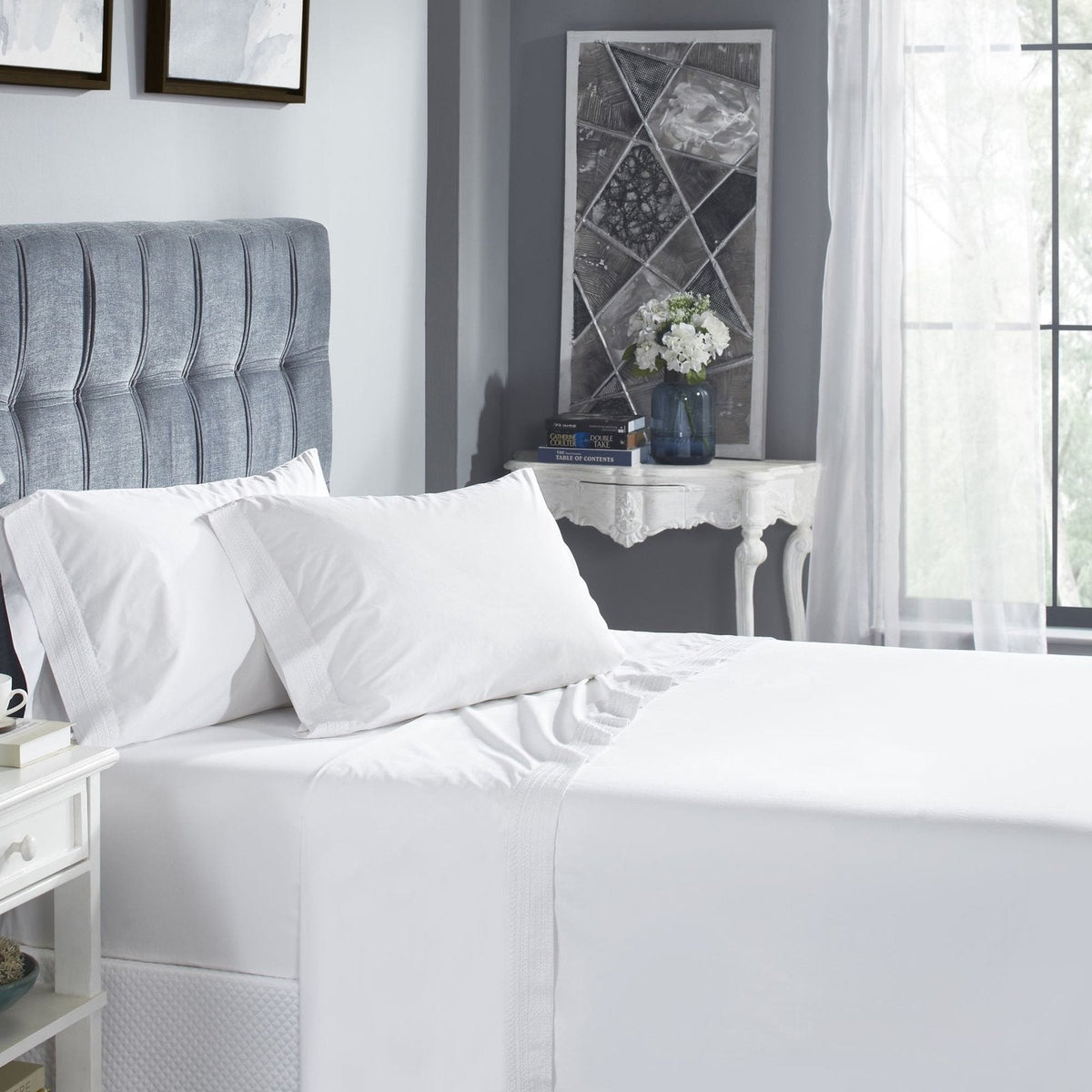 QSS-520-6080_1|Luxurious white 100% cotton sheets elegantly draped on a bed, providing ultimate comfort and serene sleep.