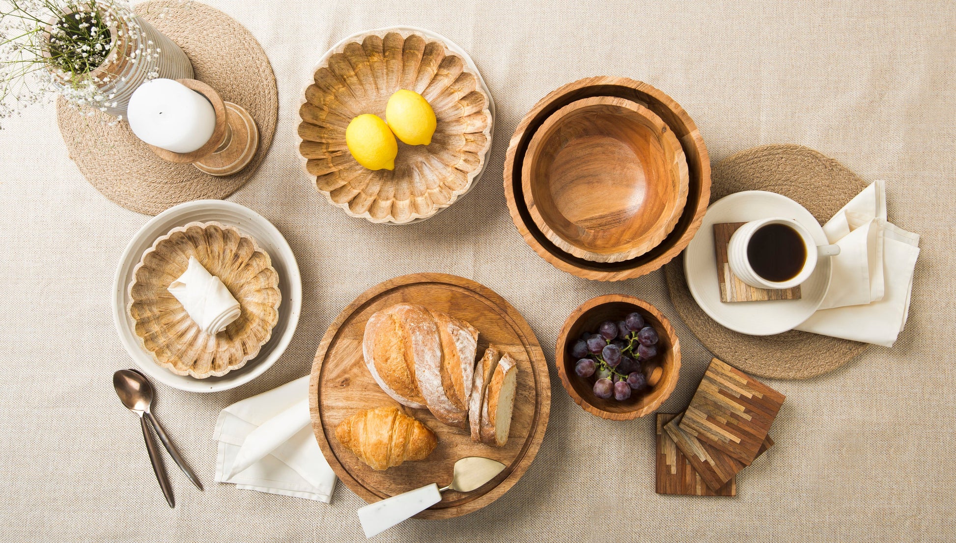 Scalloped wooden bowls styled with fruits on a dining table
