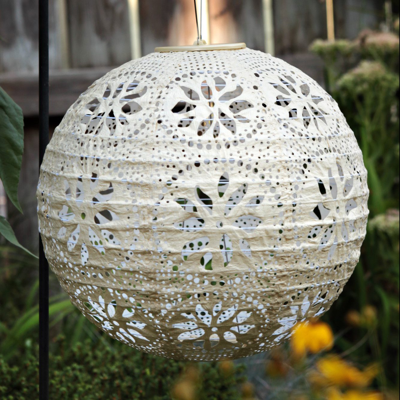 Soji Stella Boho Tyvek Solar Lantern in garden