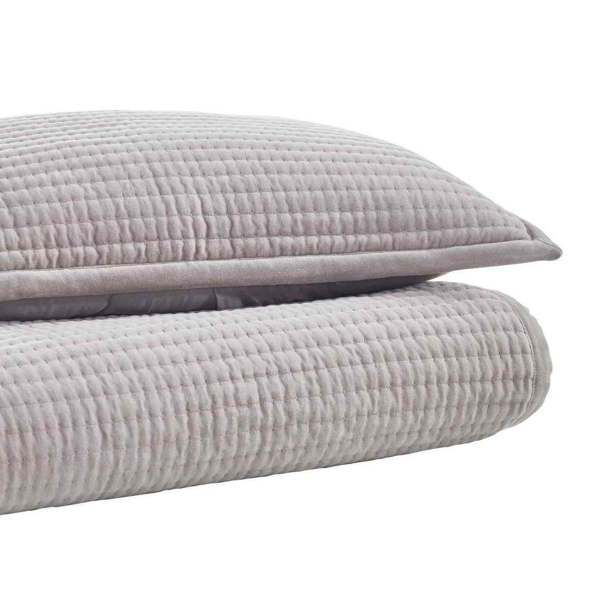 CL-188-11096_2|Stack of a light grey textured coverlet and matching pillow sham, highlighting their soft channel quilt texture.