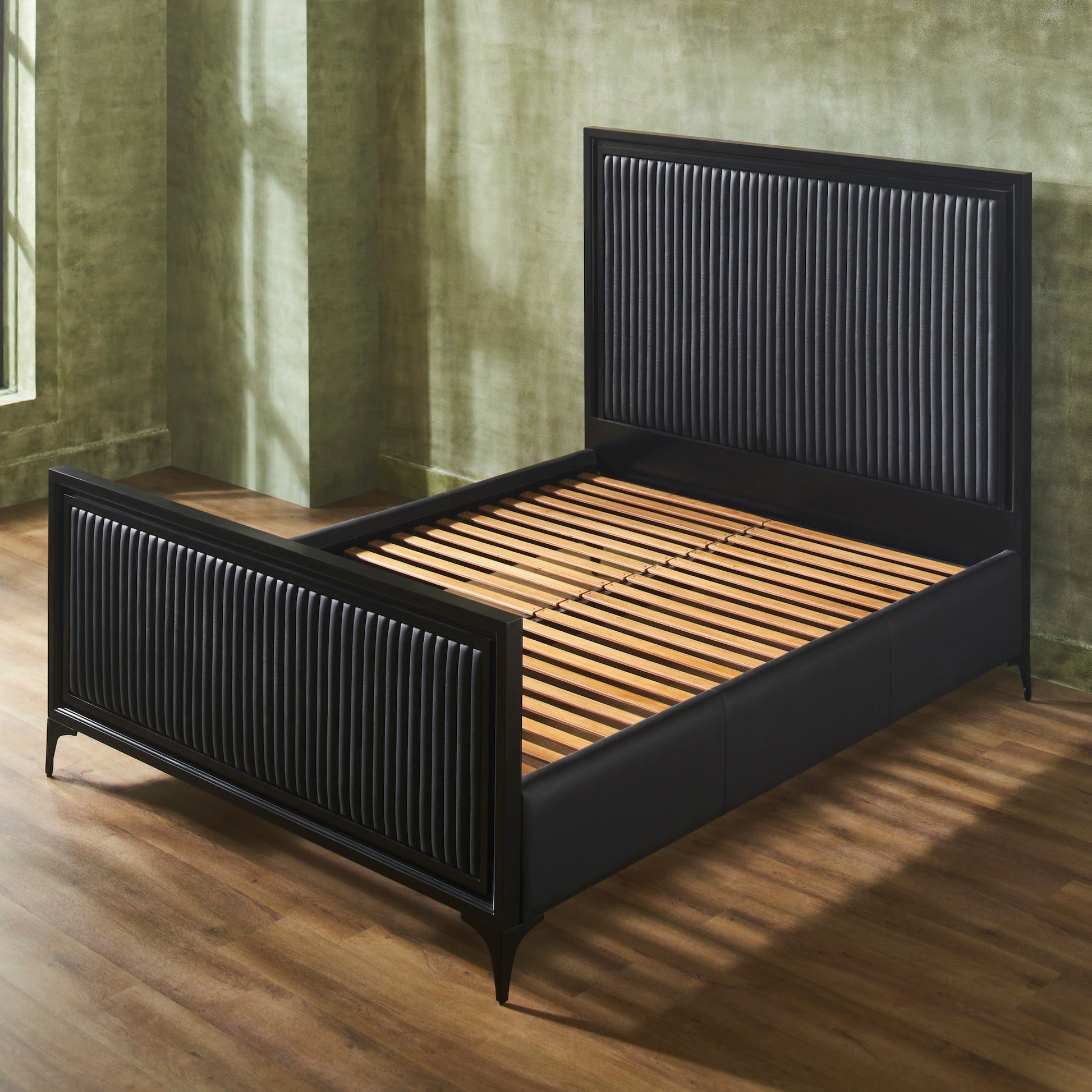 FN-5210-6080_4|Empty black channel tufted leather bed with black wooden frame, showcasing elegant bedroom furniture design with slats.