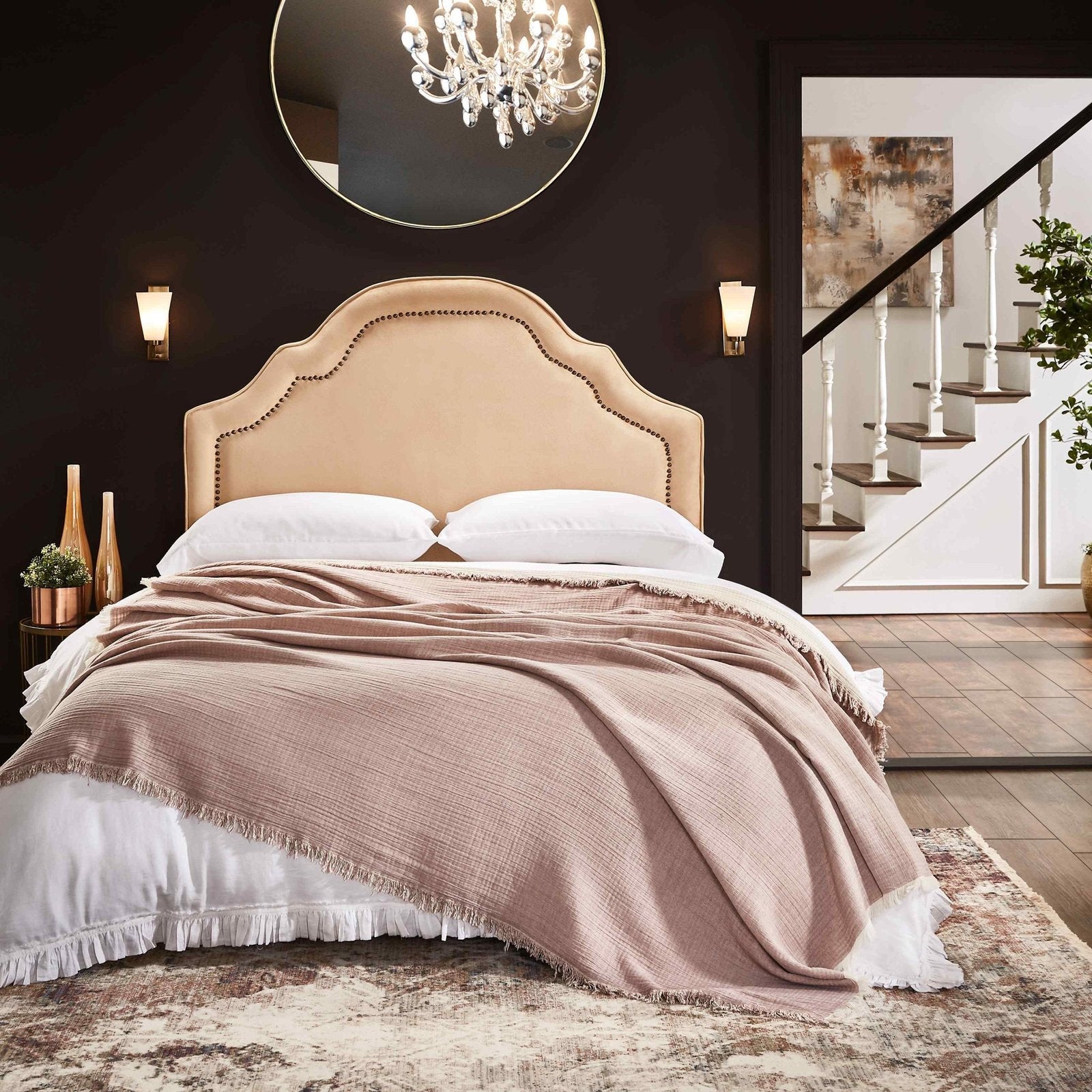 BT-110-11096_4|Chic dusty pink crinkled blanket with frayed edges casually draped over a bed, perfect for a cozy bedroom feel.