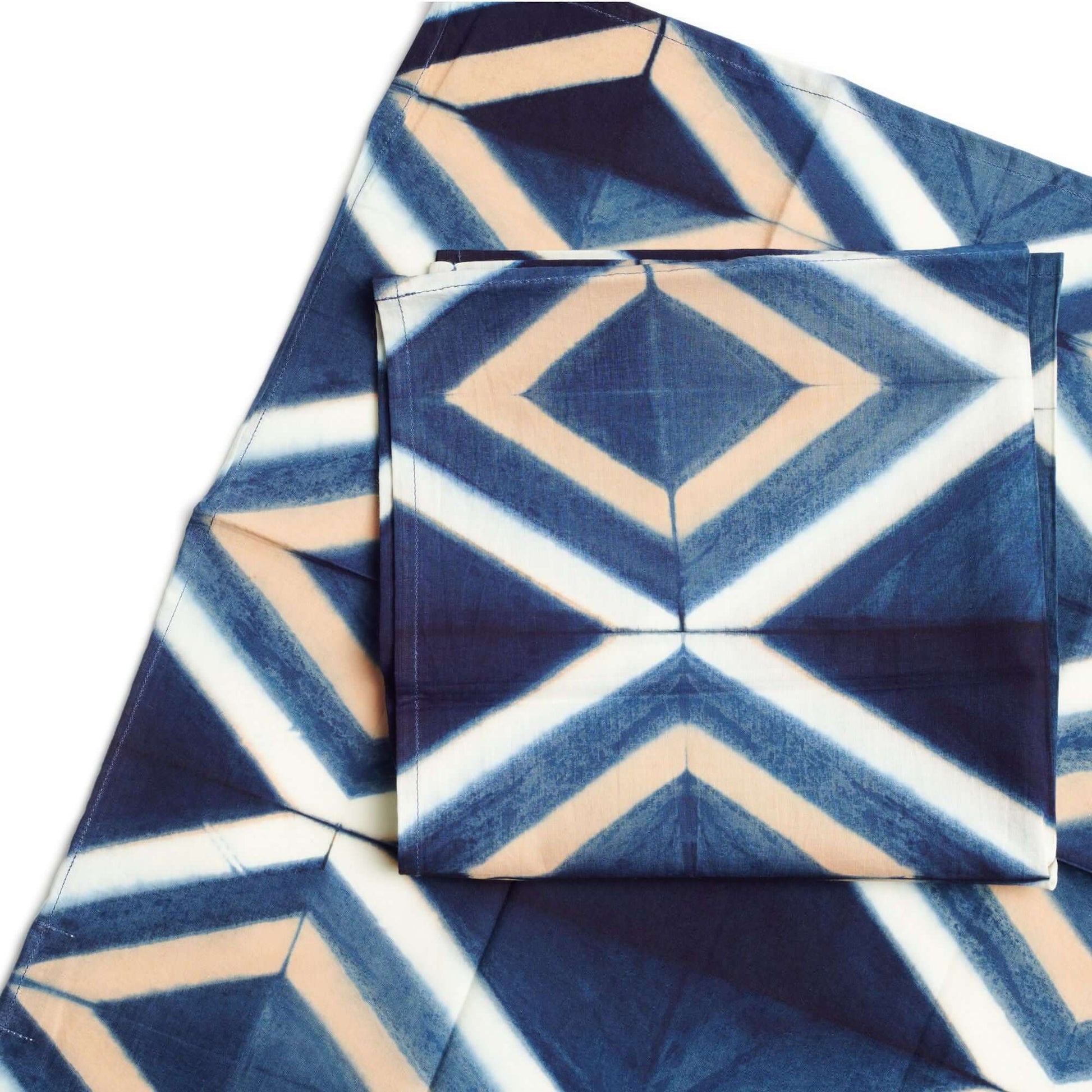 Tisa Indigo Hand Crafted Shibori Print Cotton Table Napkin set of 4 featuring a geometric blue and ivory design.