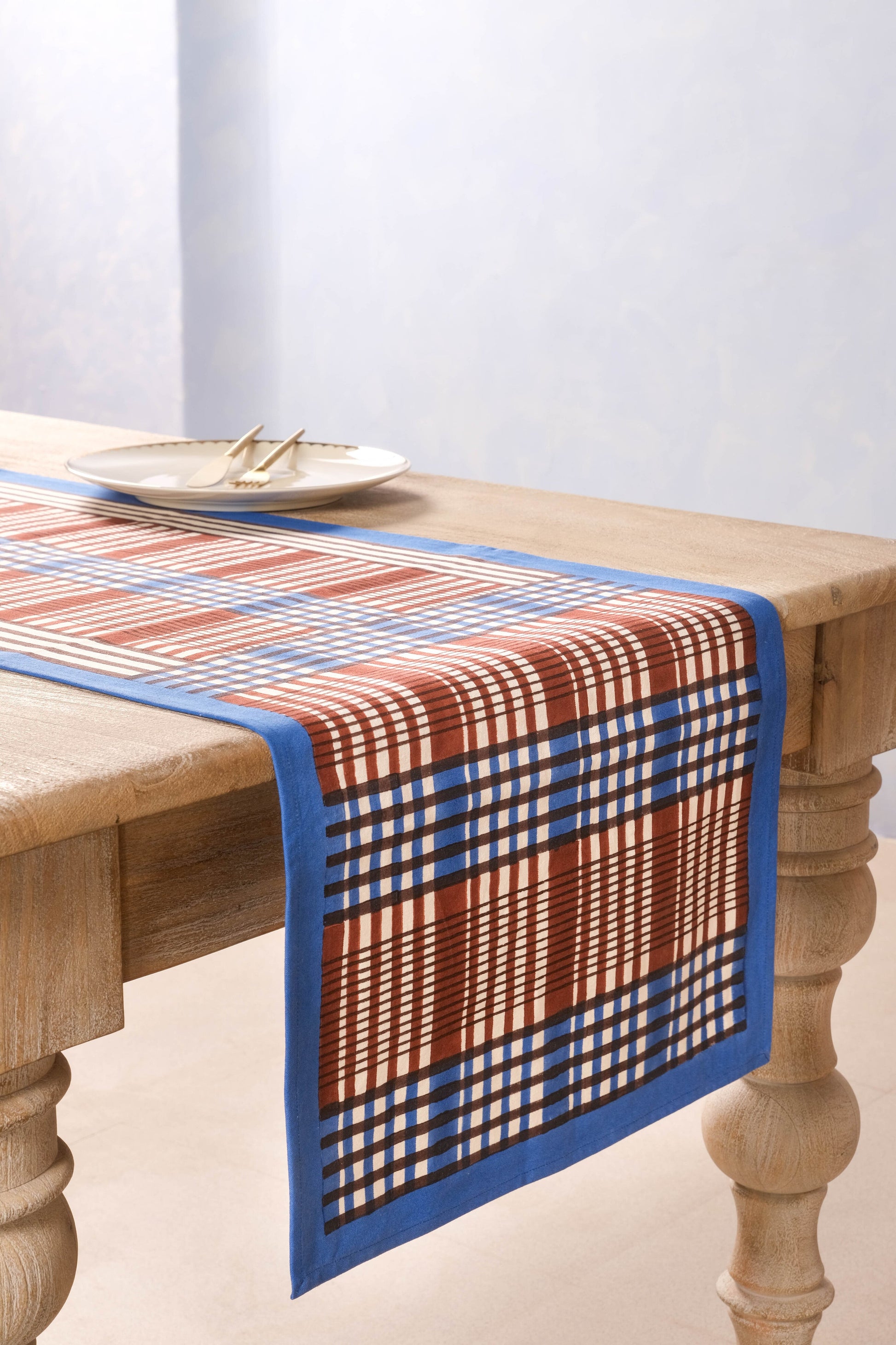 Brown and blue Shetland blockprint taberunner on wooden table