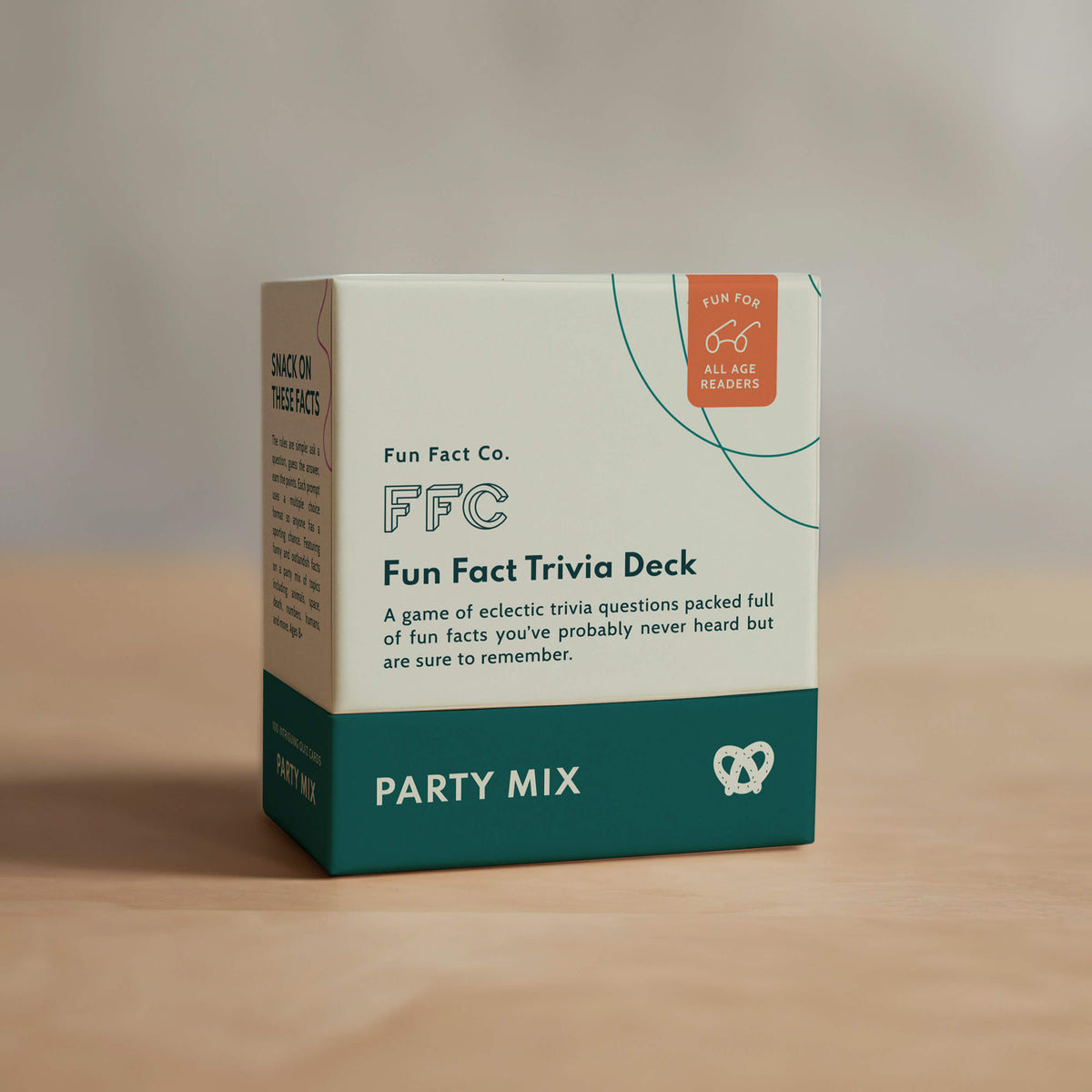 Box of Fun Fact Co. Fun Fact Trivia Deck on a wooden surface with a neutral background