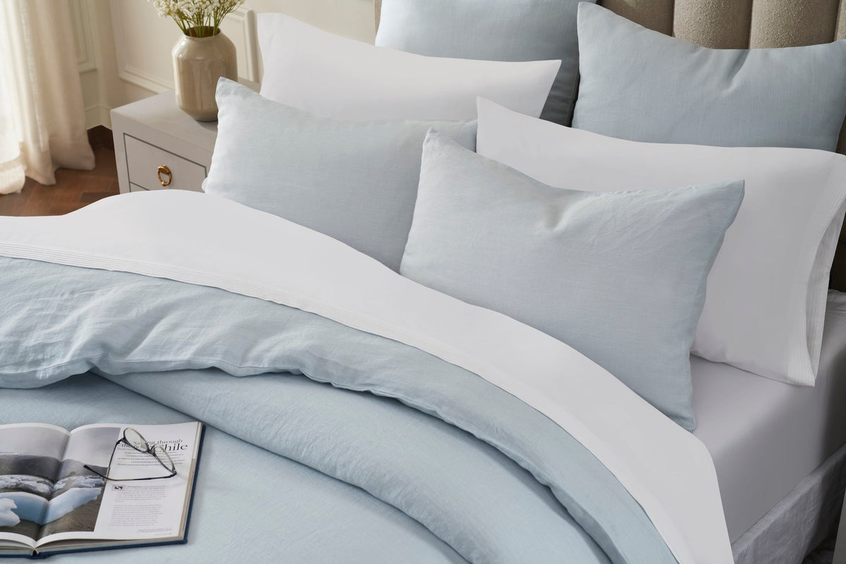 DT-042-10692_5|Folded light blue linen-blend duvet cover & shams, solid, soft, relaxed elegant bedding for serene sleep.