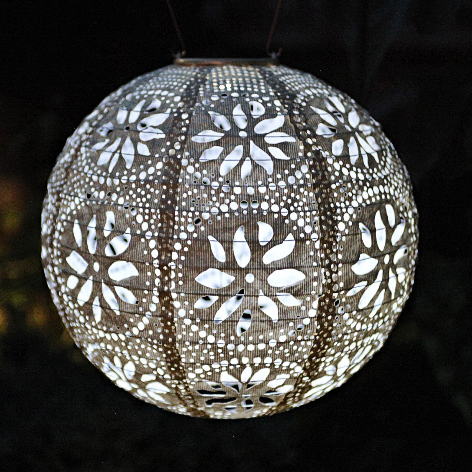 Soji Stella Boho Tyvek Solar Lantern illuminated at night
